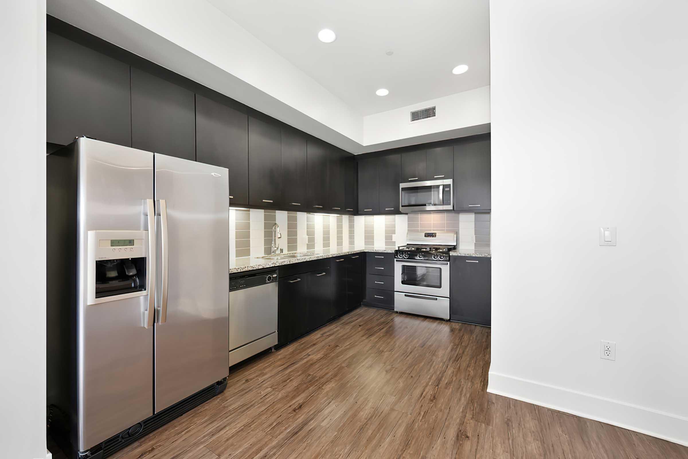 a stainless steel refrigerator in a kitchen