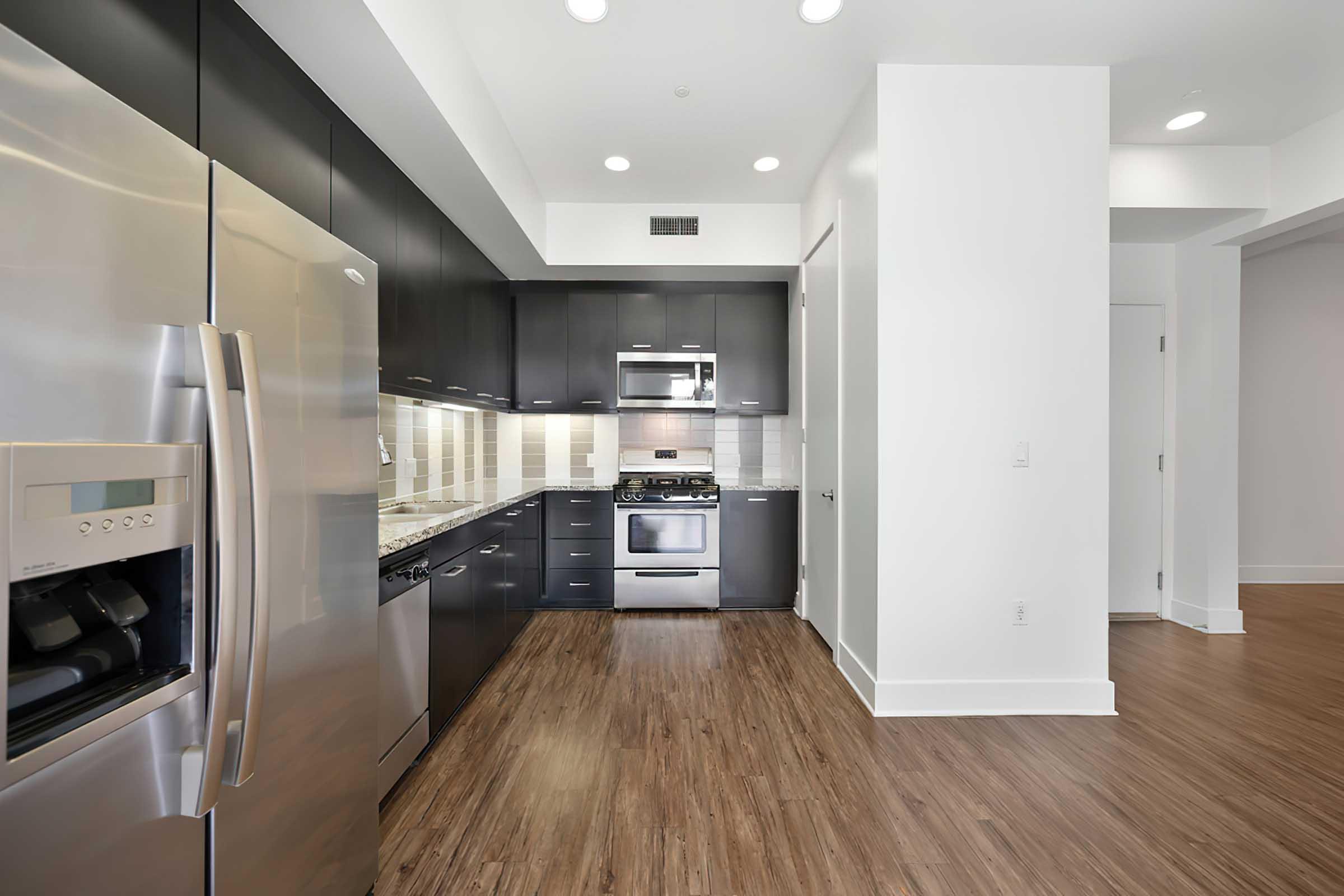 a large kitchen with stainless steel appliances