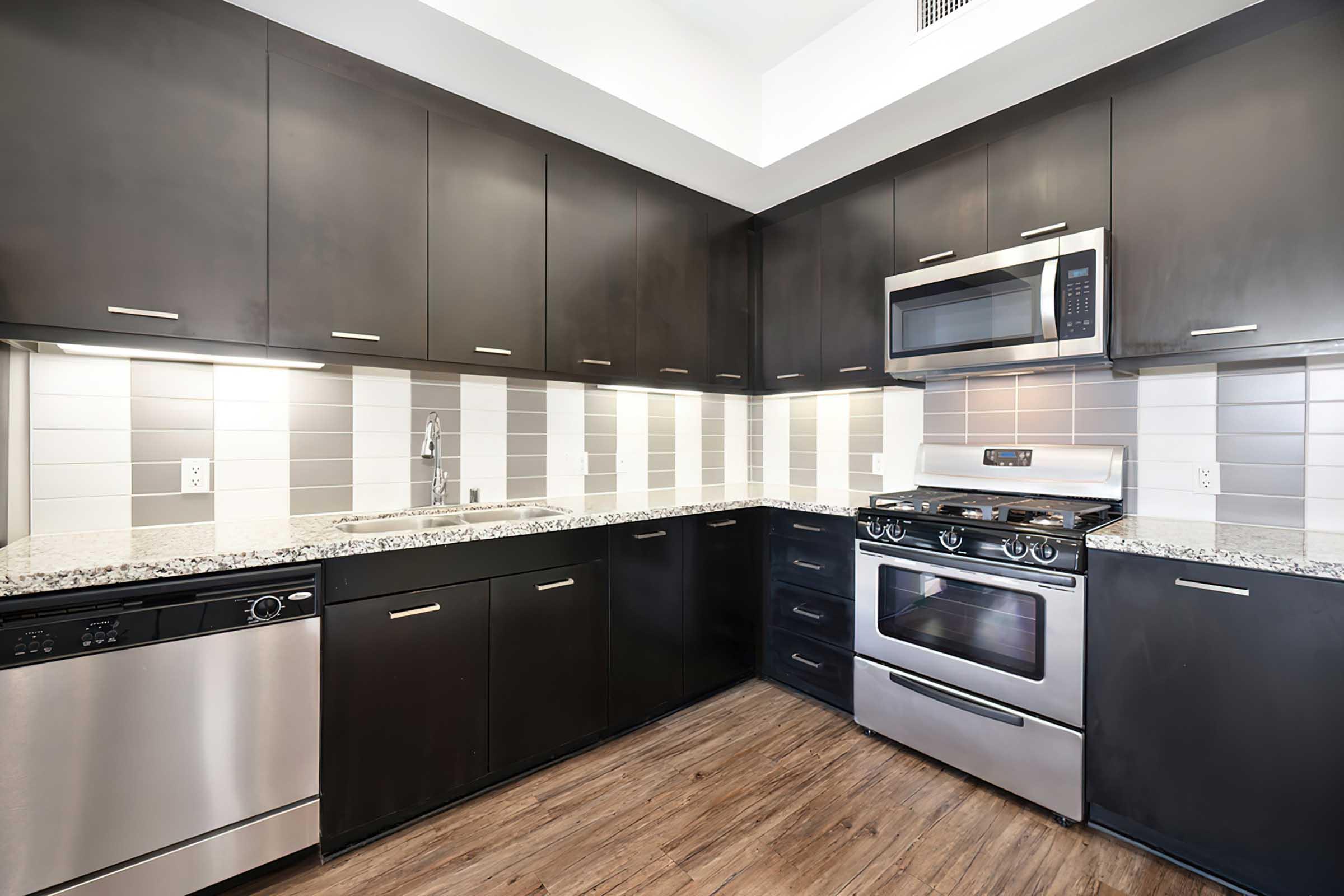 a modern kitchen with stainless steel appliances