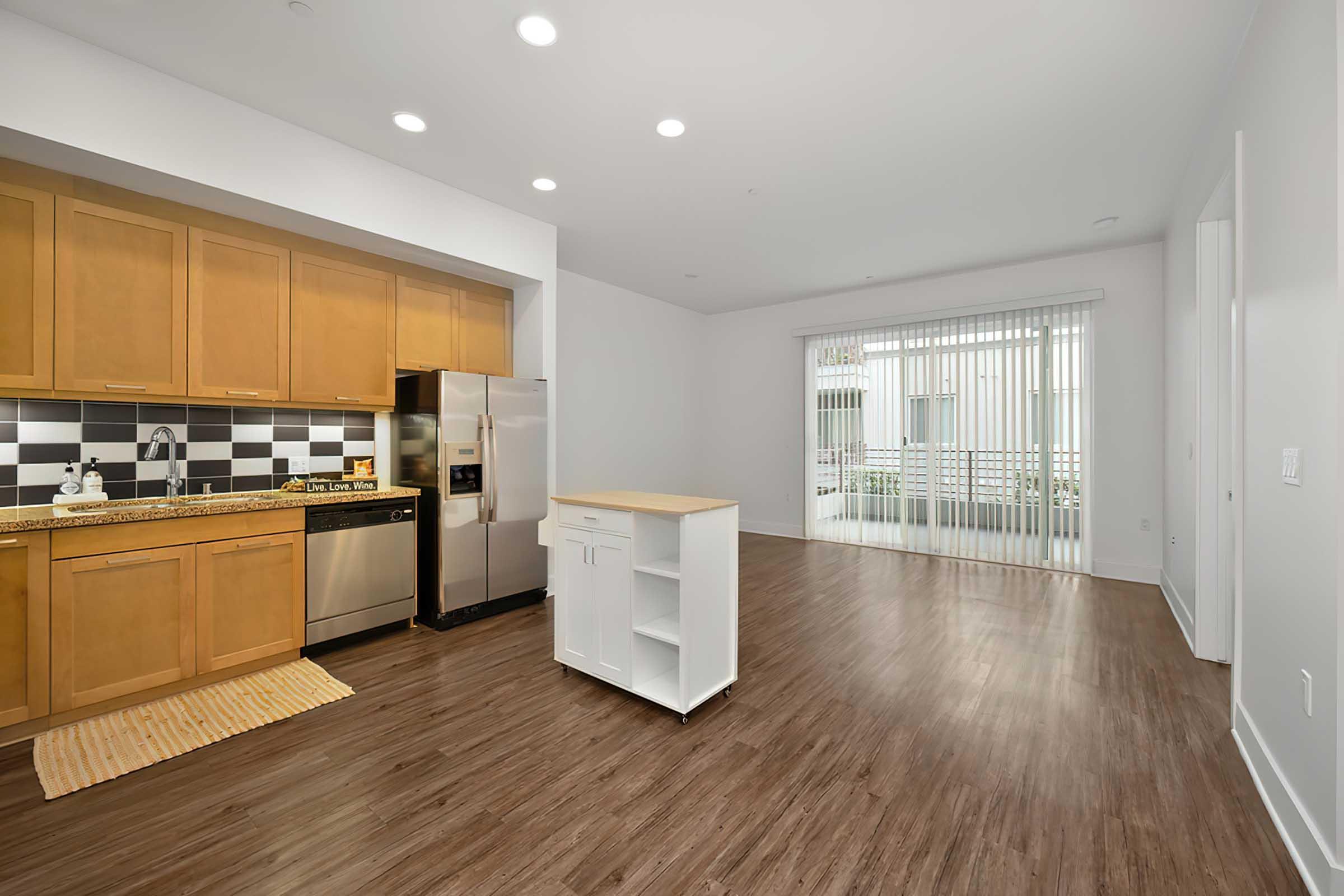 a kitchen with a wood floor