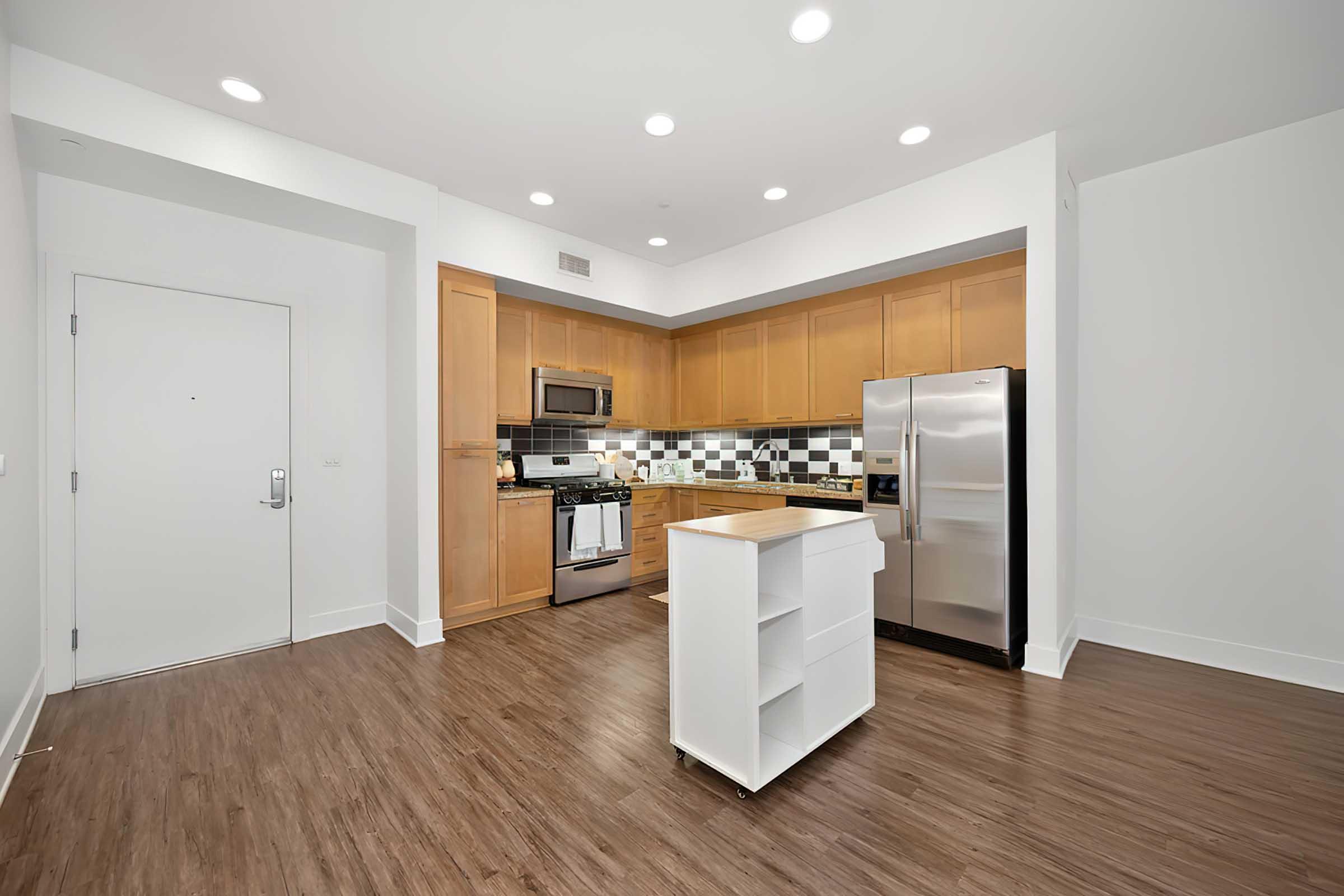 a kitchen with tile backsplash