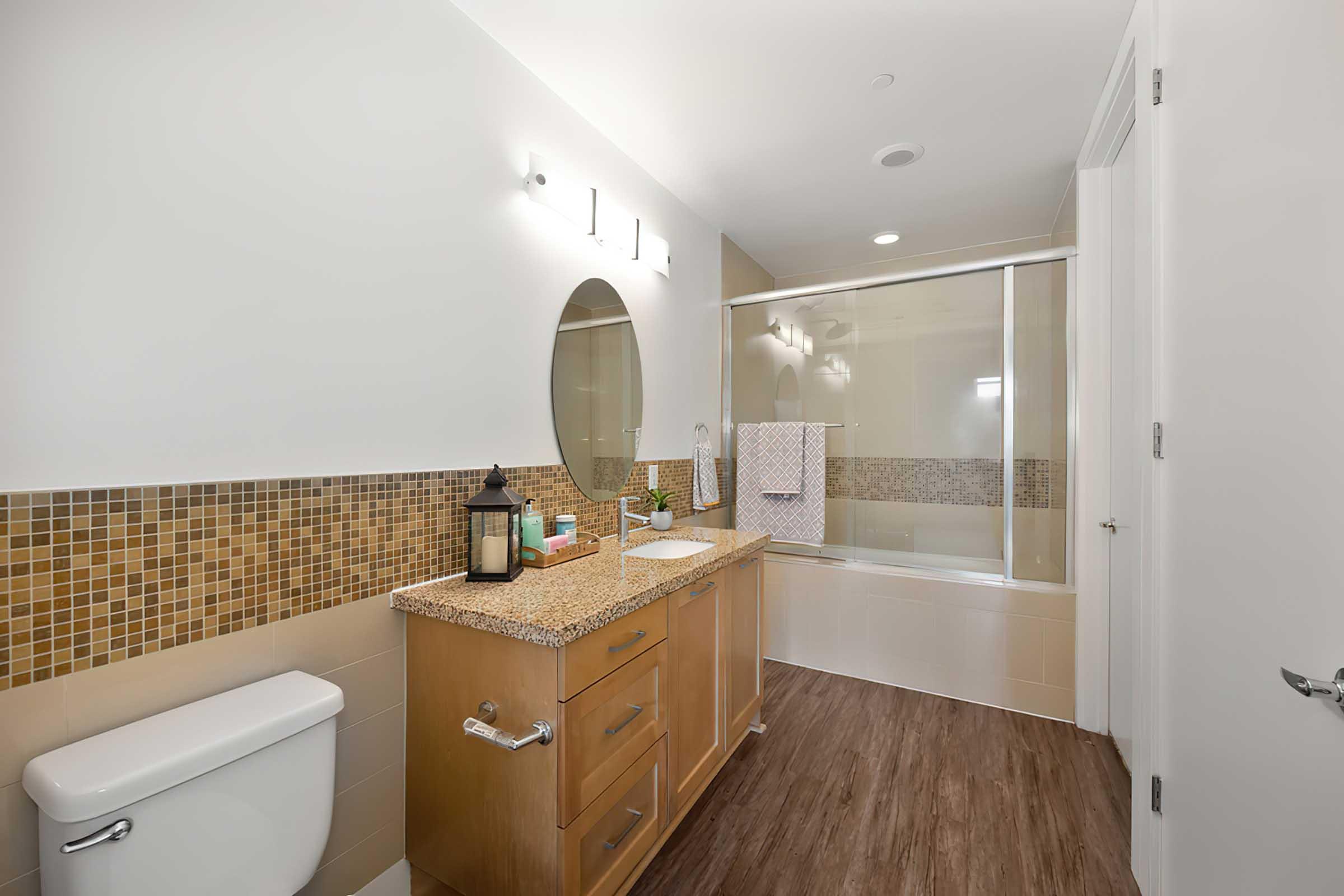 a bathroom vanity with tile surrounds