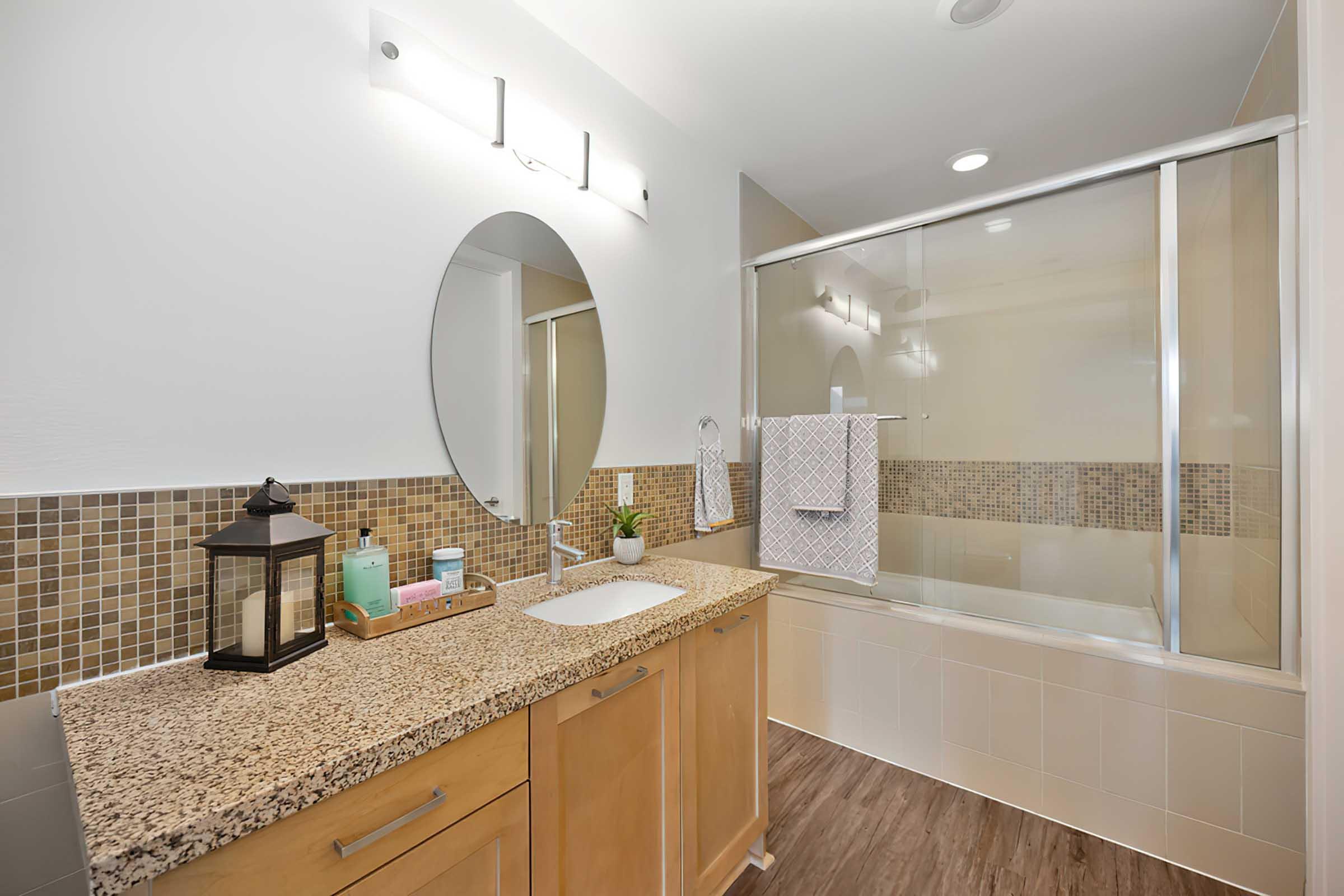 a bathroom with a sink and shower