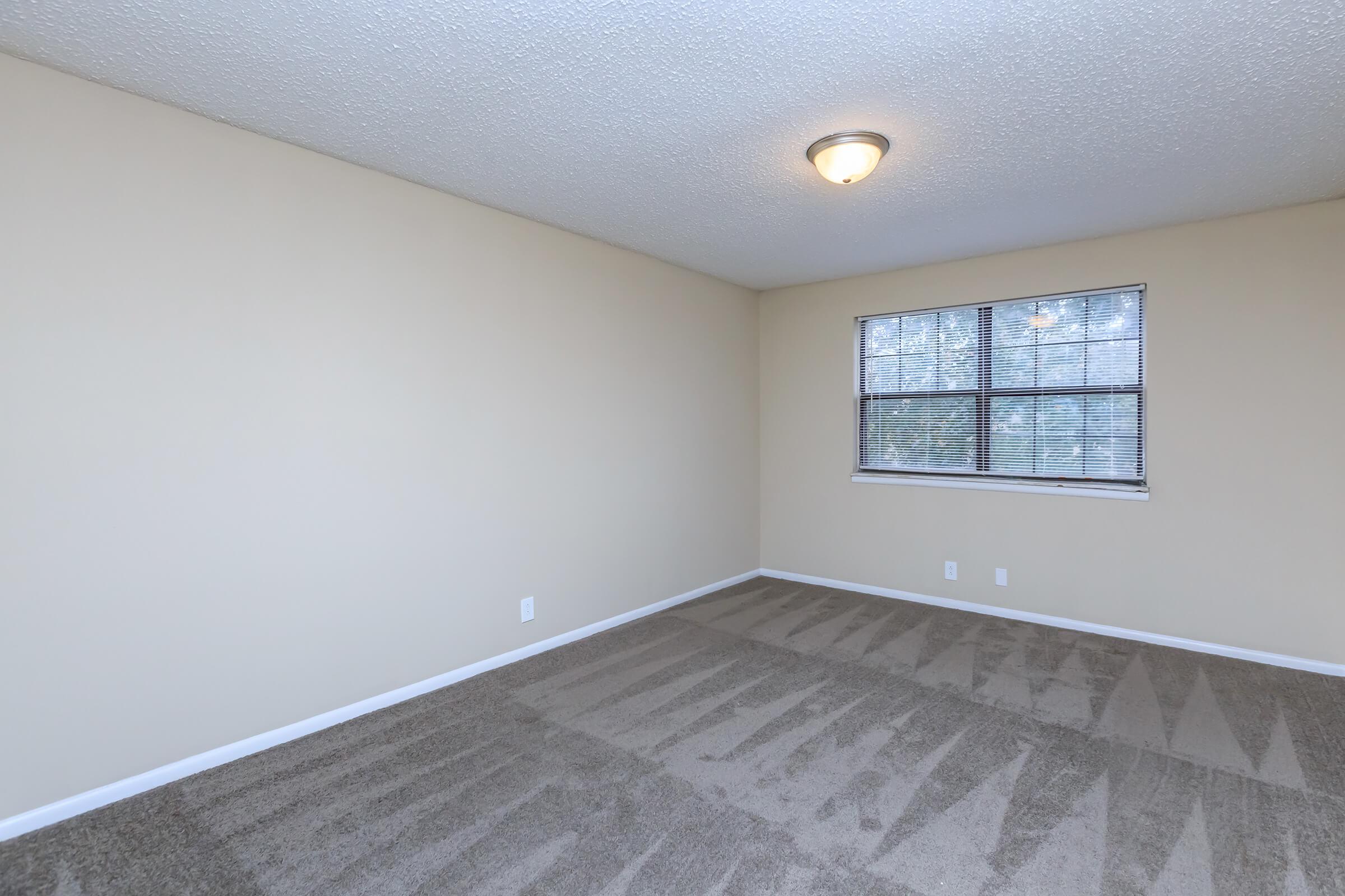 Plush carpeted bedroom at Eagles Crest at Jack Miller in Clarksville, Tennessee