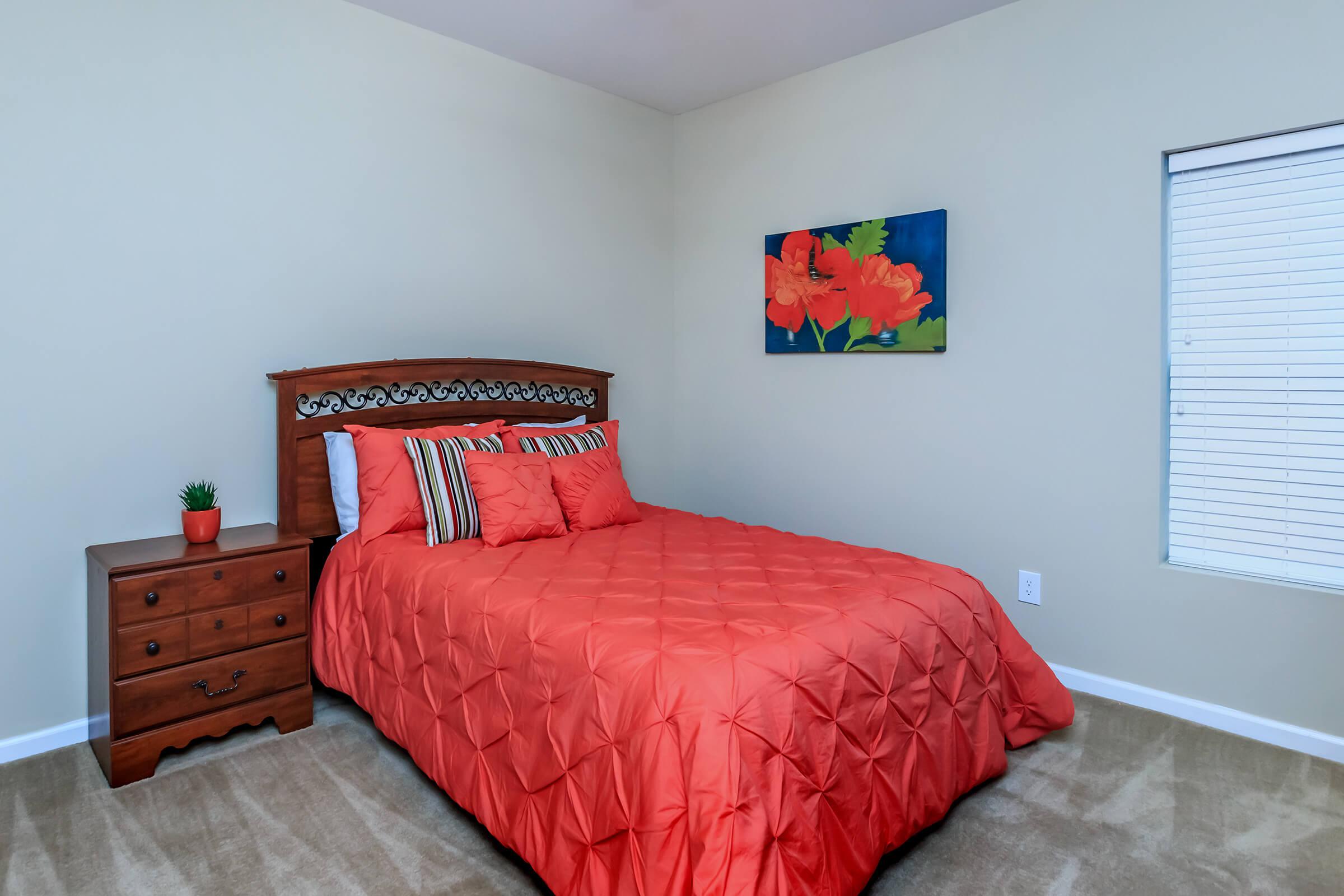 Bedroom with carpeted floors at Eagles Crest at Jack Miller in Clarksville, Tennessee