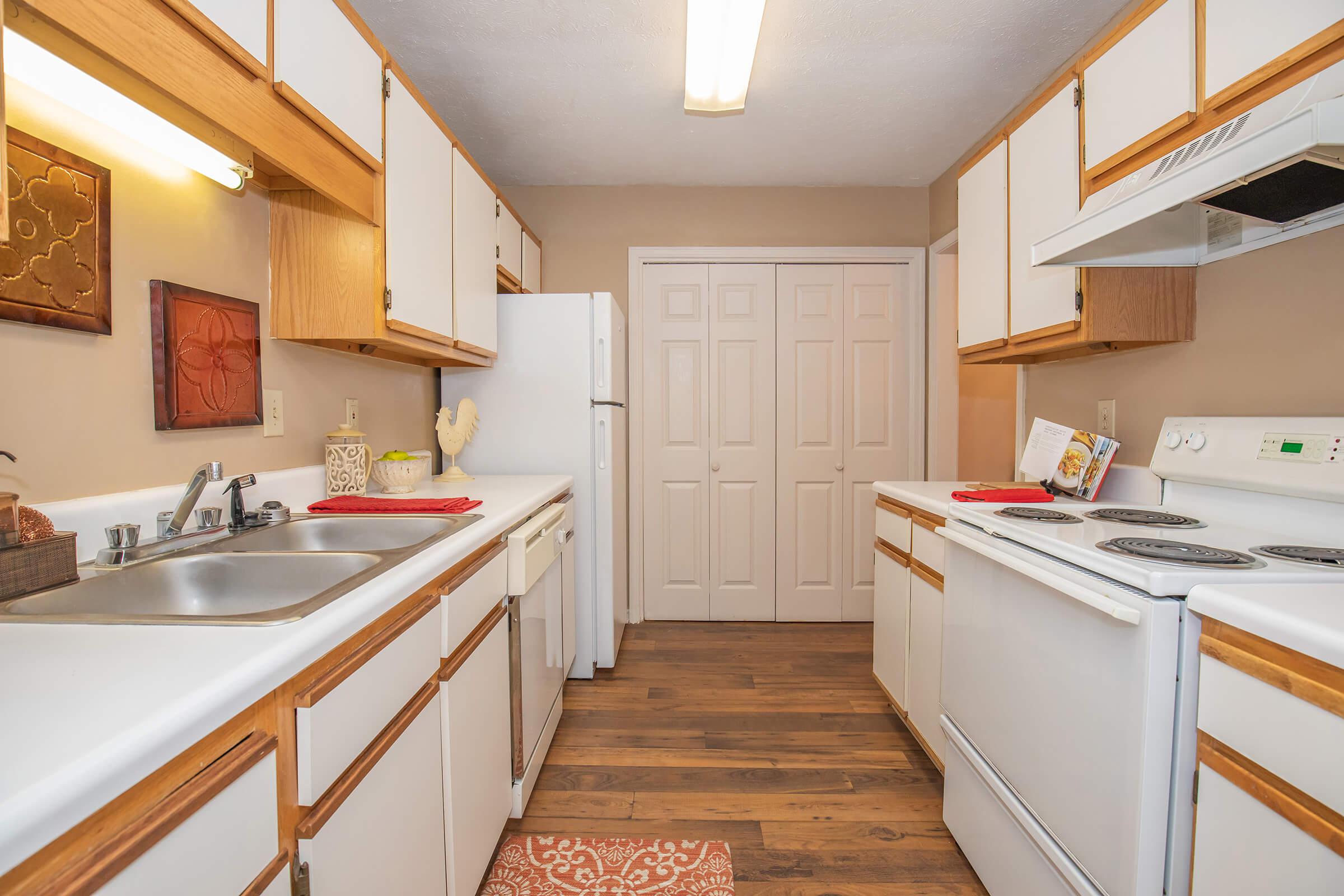 a kitchen with a stove and a sink