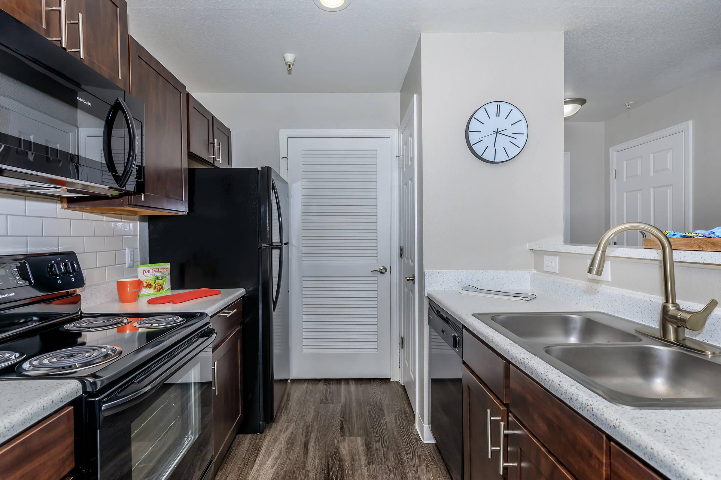 a large kitchen with stainless steel appliances