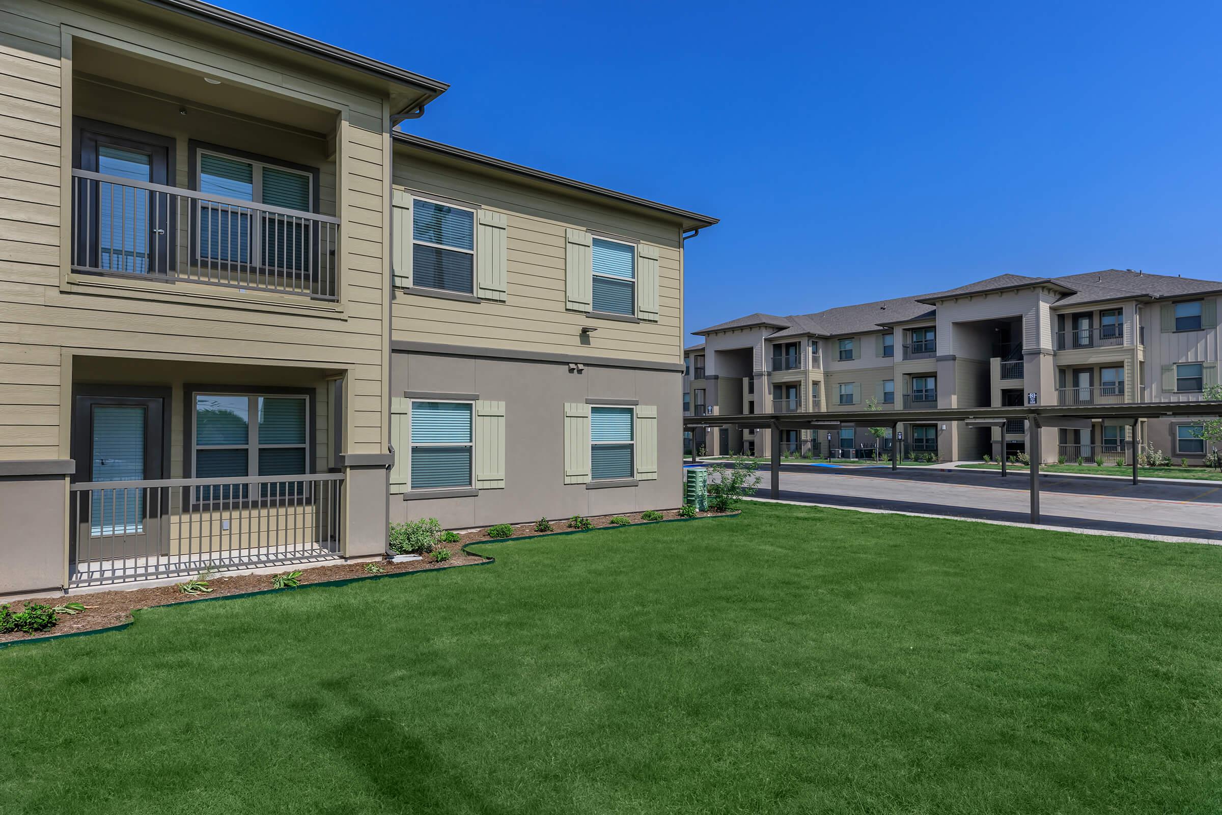 a large lawn in front of a house