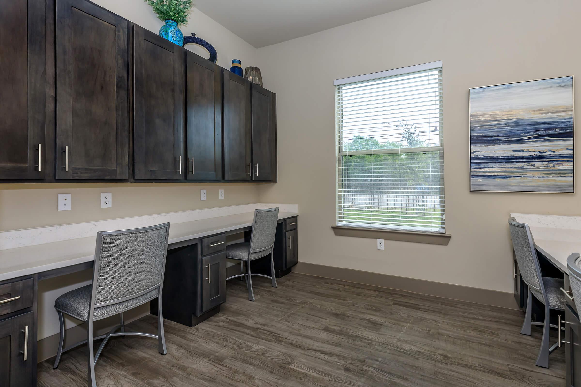 a room filled with furniture and a large window