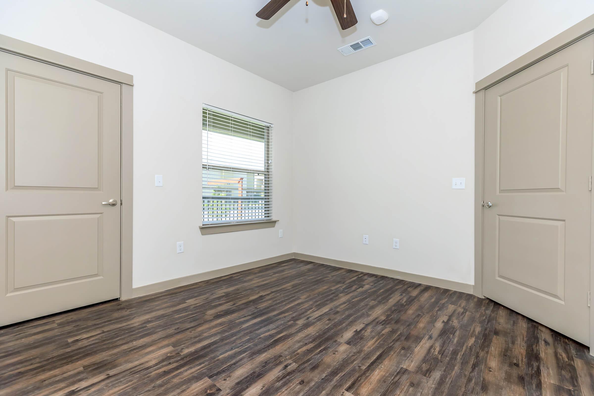 a kitchen with a wooden floor