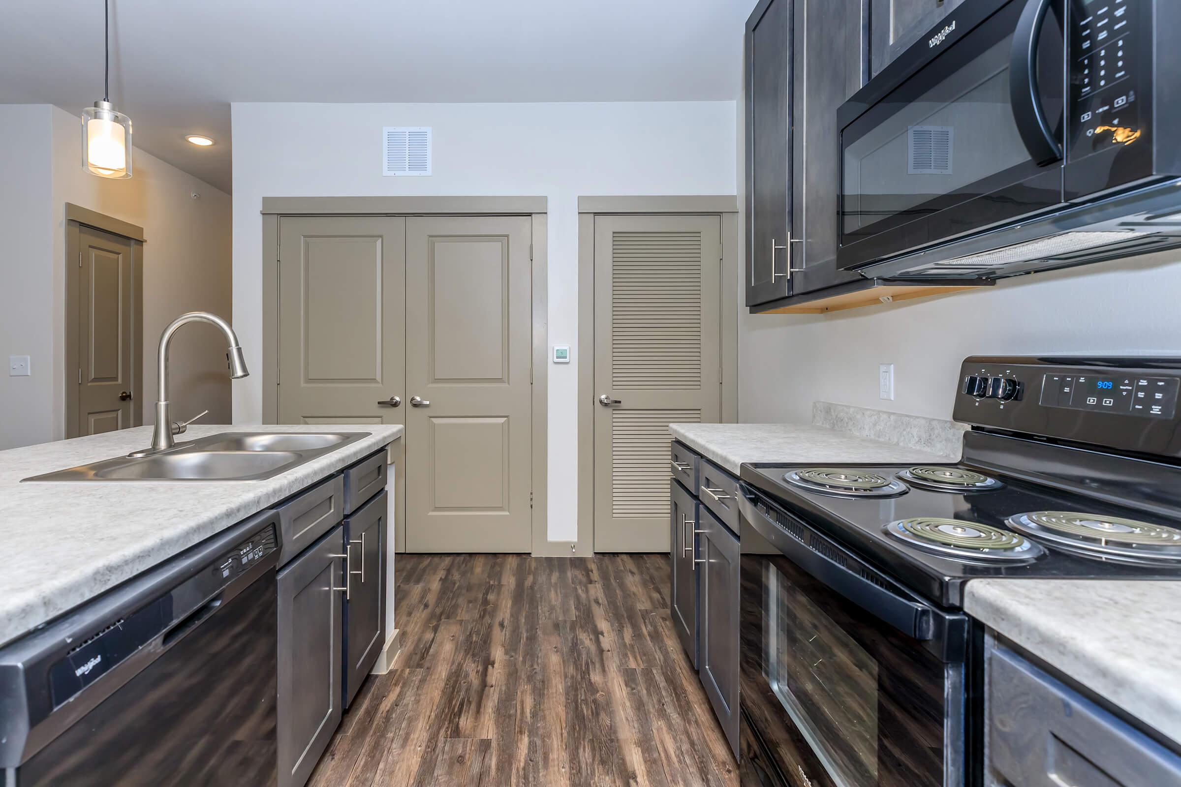 a kitchen with a stove top oven