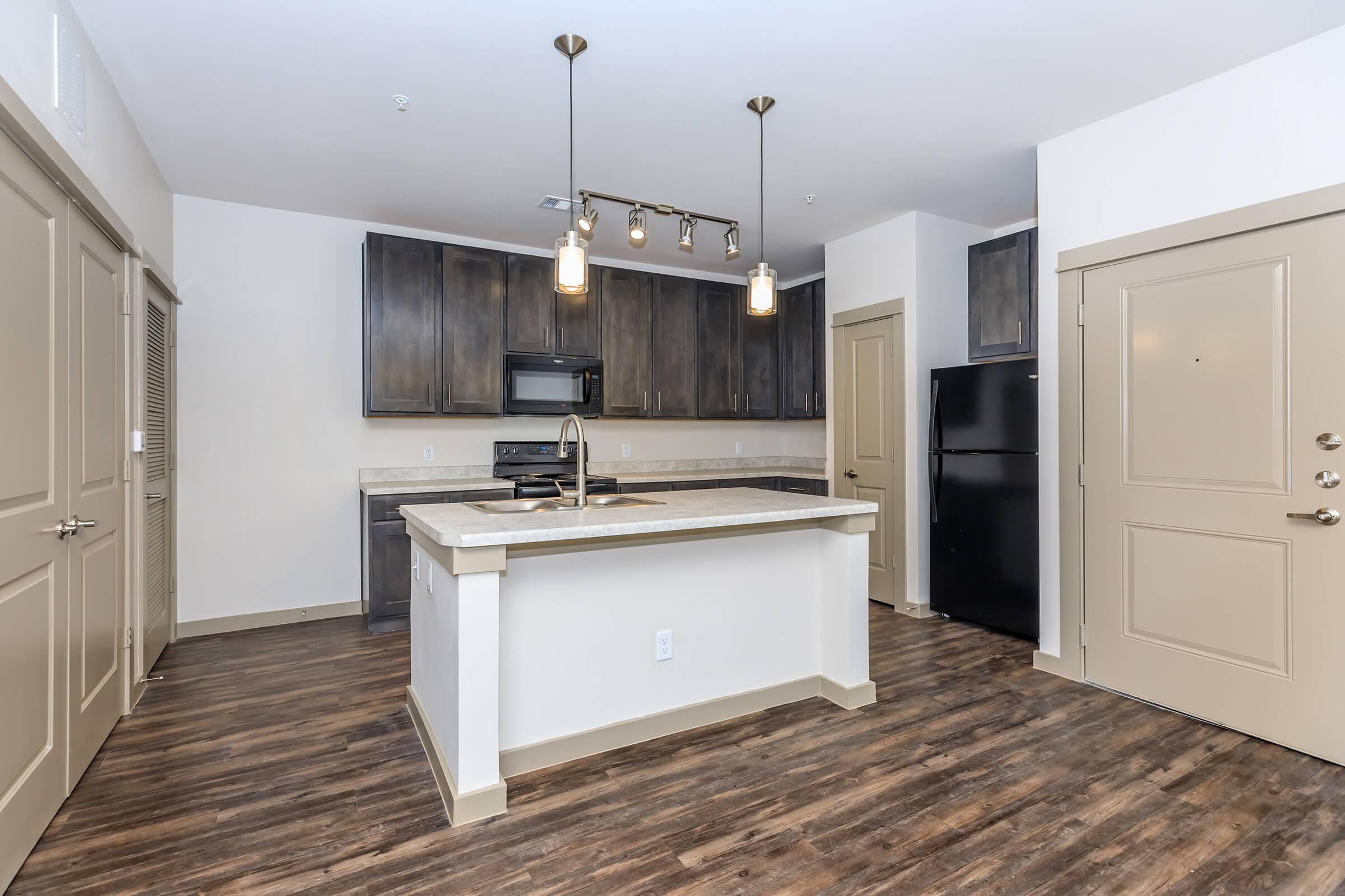 a kitchen with a wooden floor