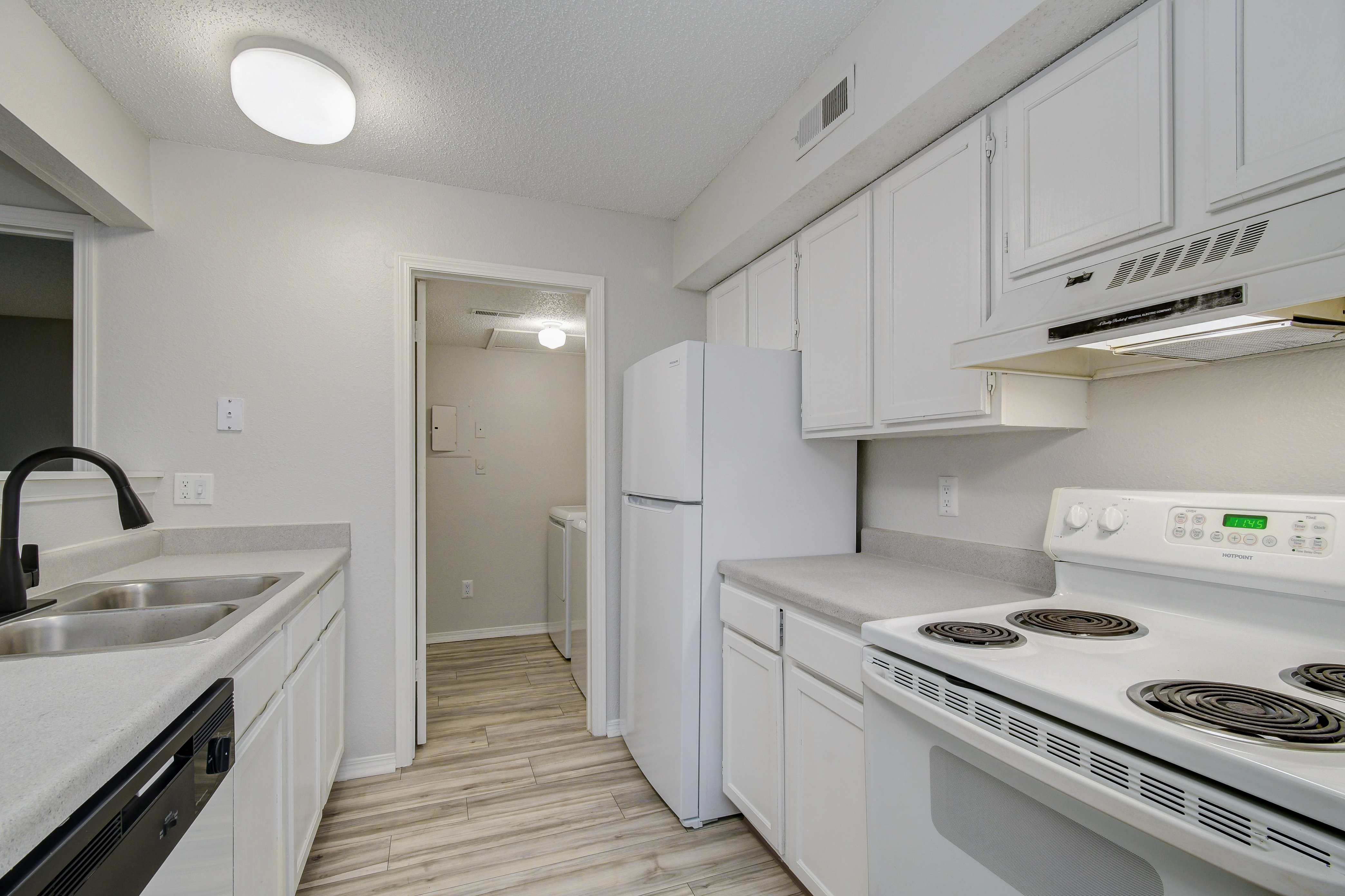 Updated white cabinets at Rainbow Ridge Apartments in Kansas City, Kansas