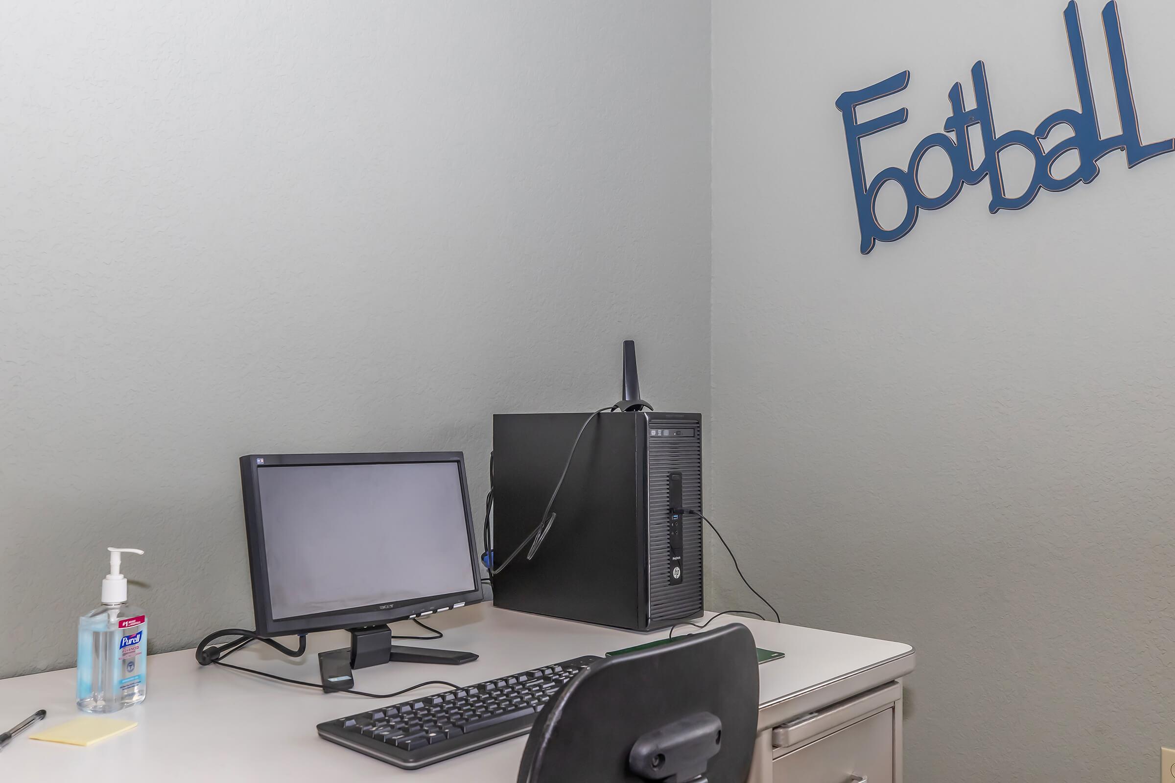 a computer sitting on top of a table