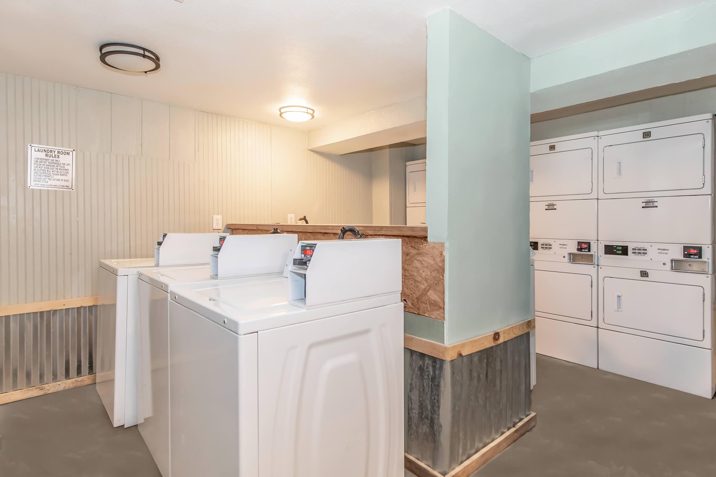 a kitchen with a sink and a mirror