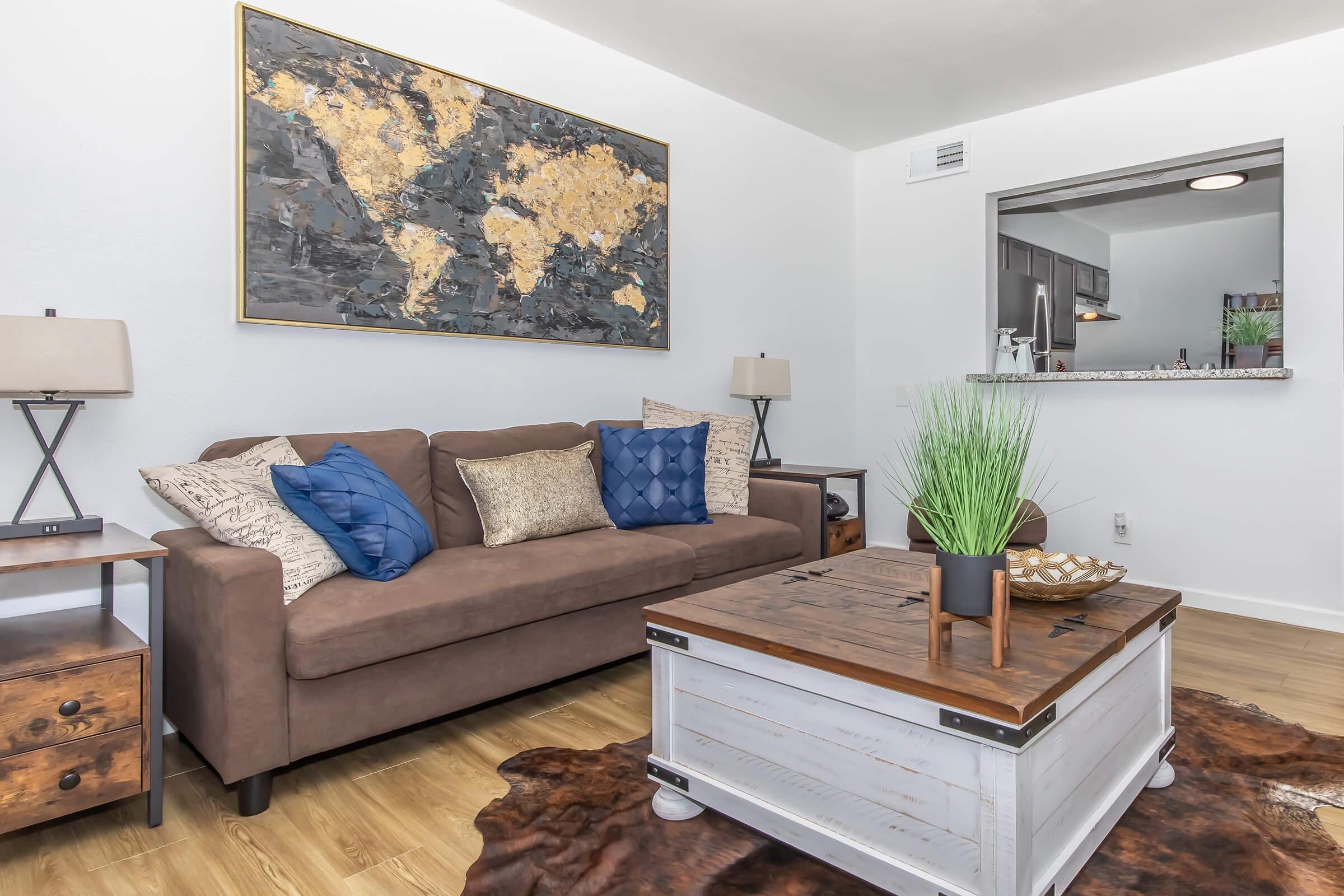 a living room filled with furniture and a fireplace