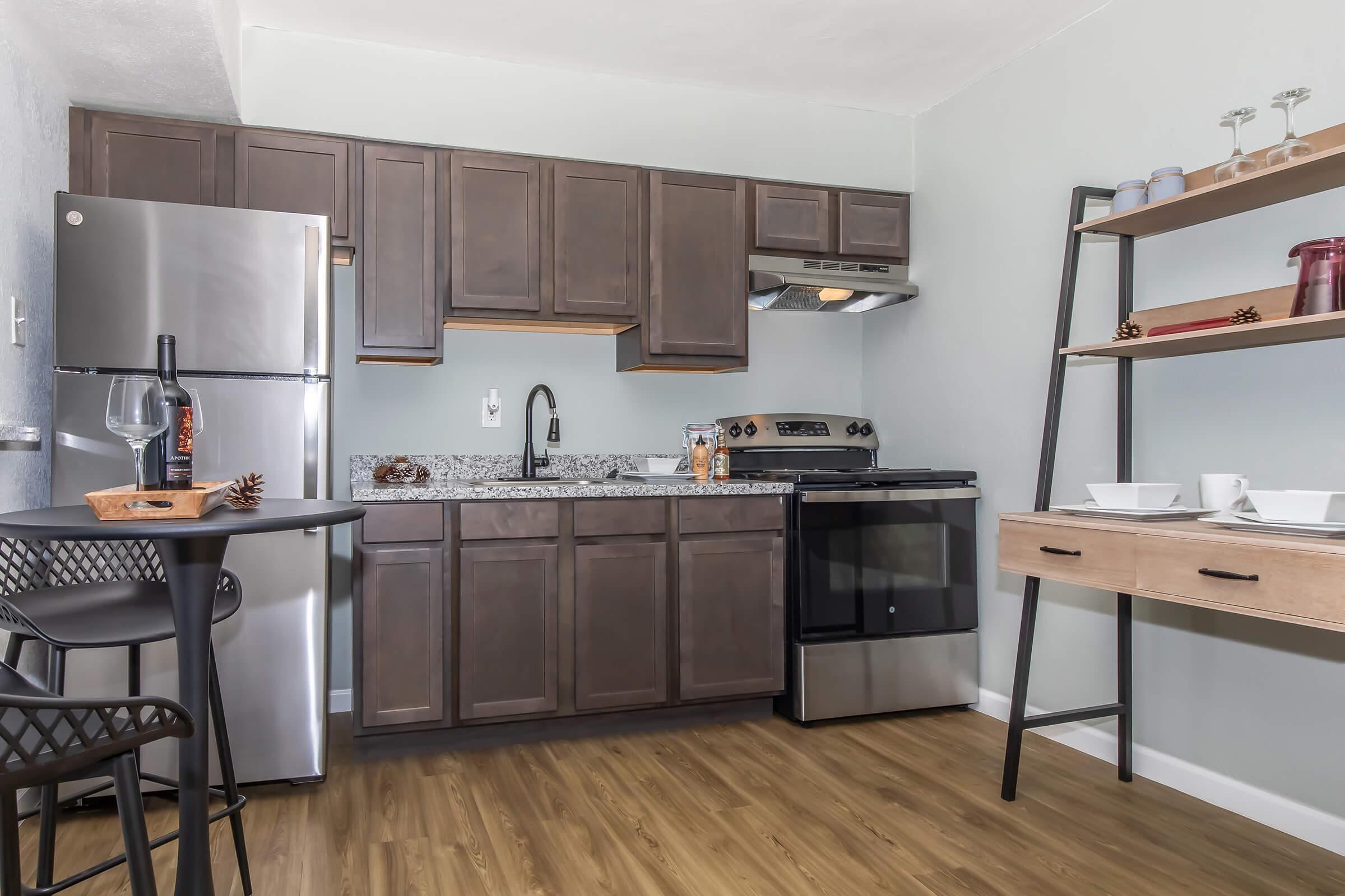 a kitchen with a table in a room