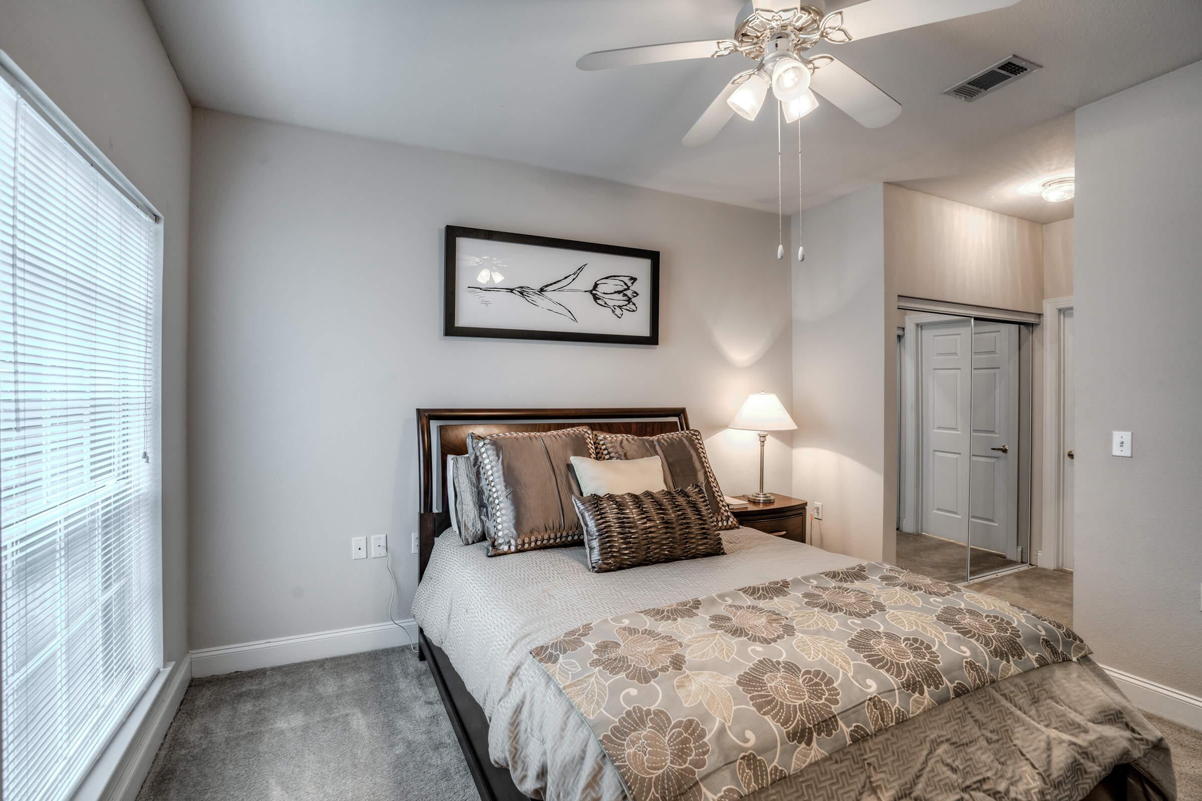 a bedroom with a large bed in a hotel room