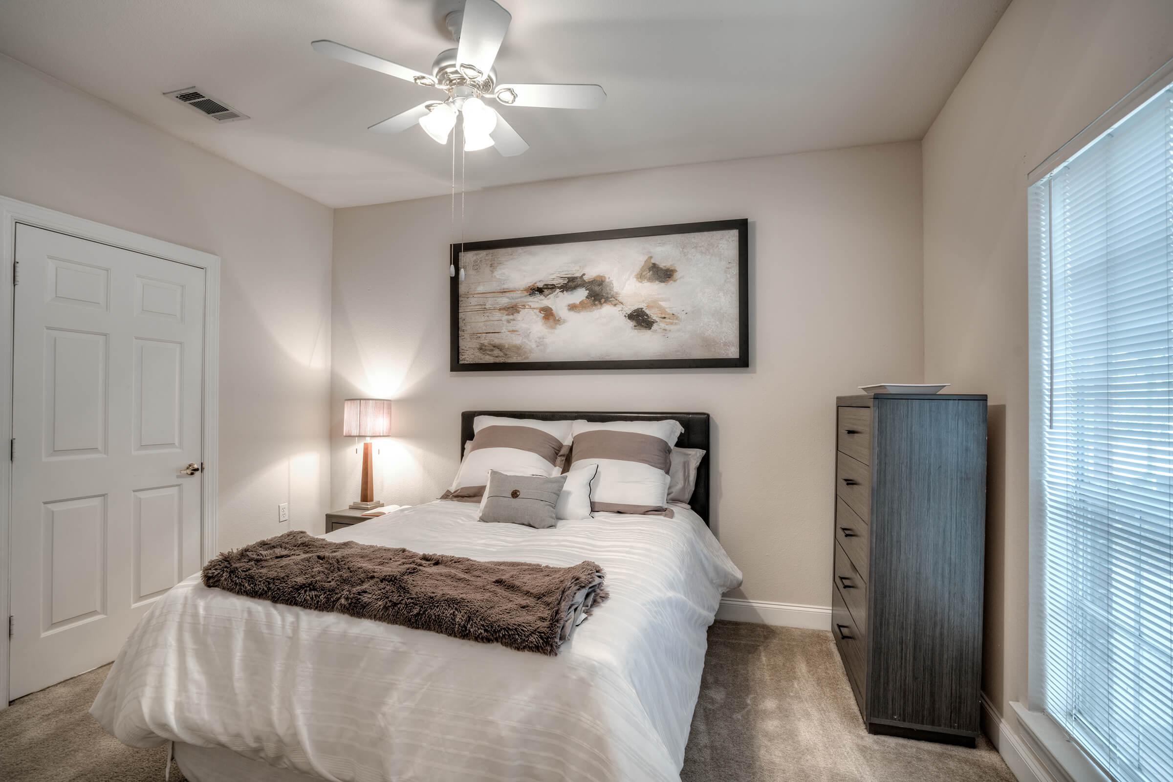 a bedroom with a large bed in a hotel room