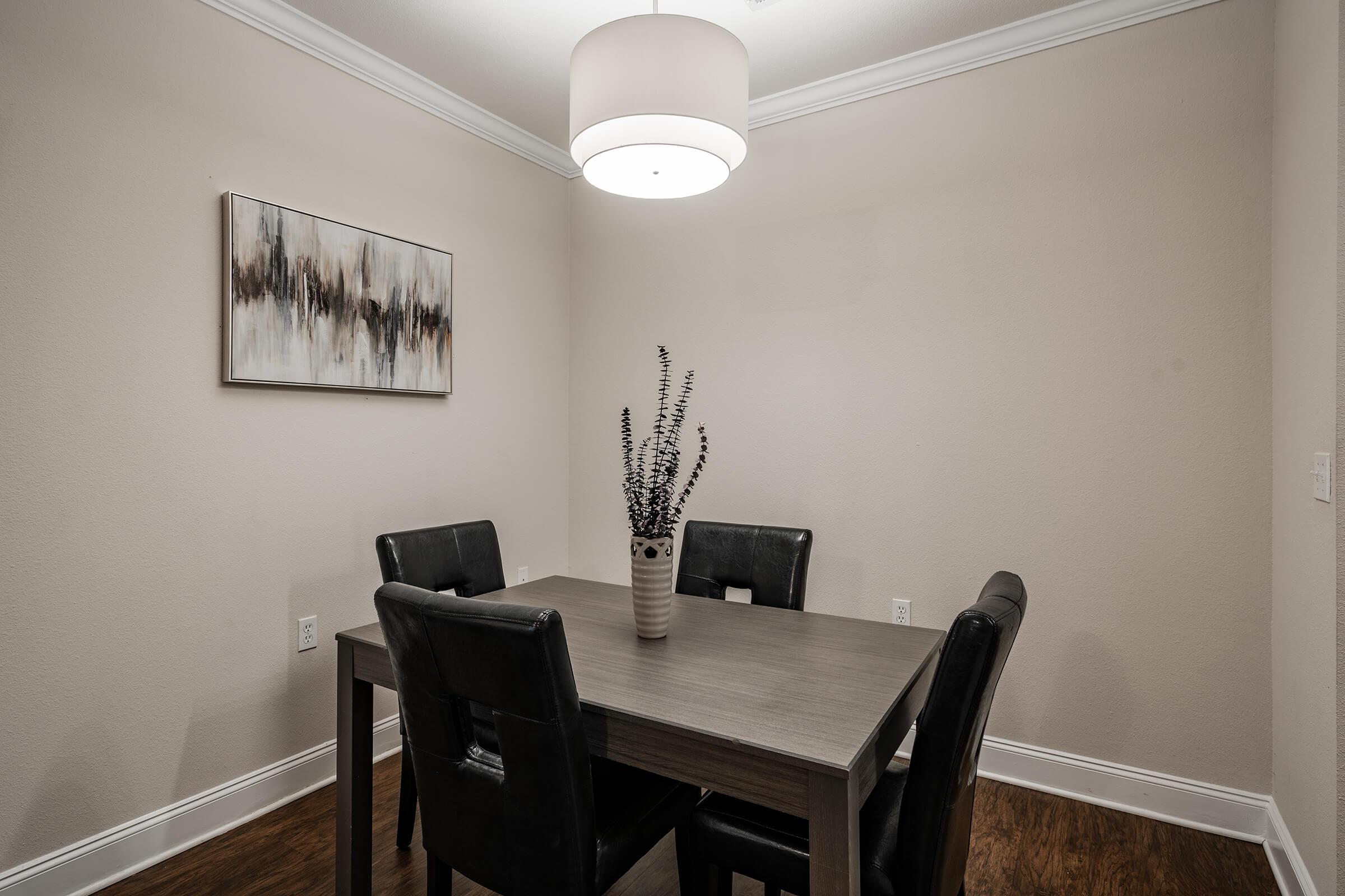 a dining room table in front of a mirror