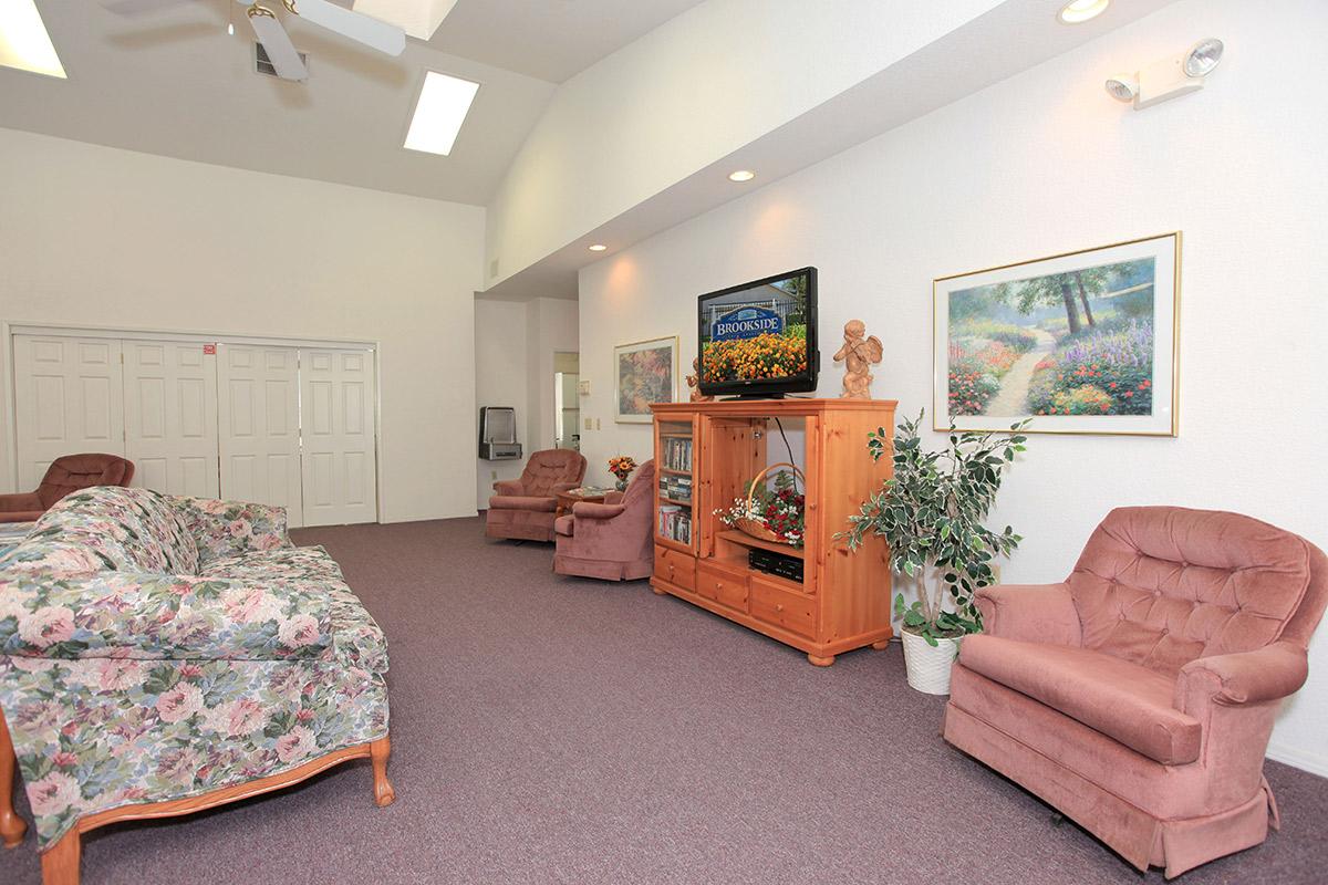 a living room filled with furniture and a fireplace