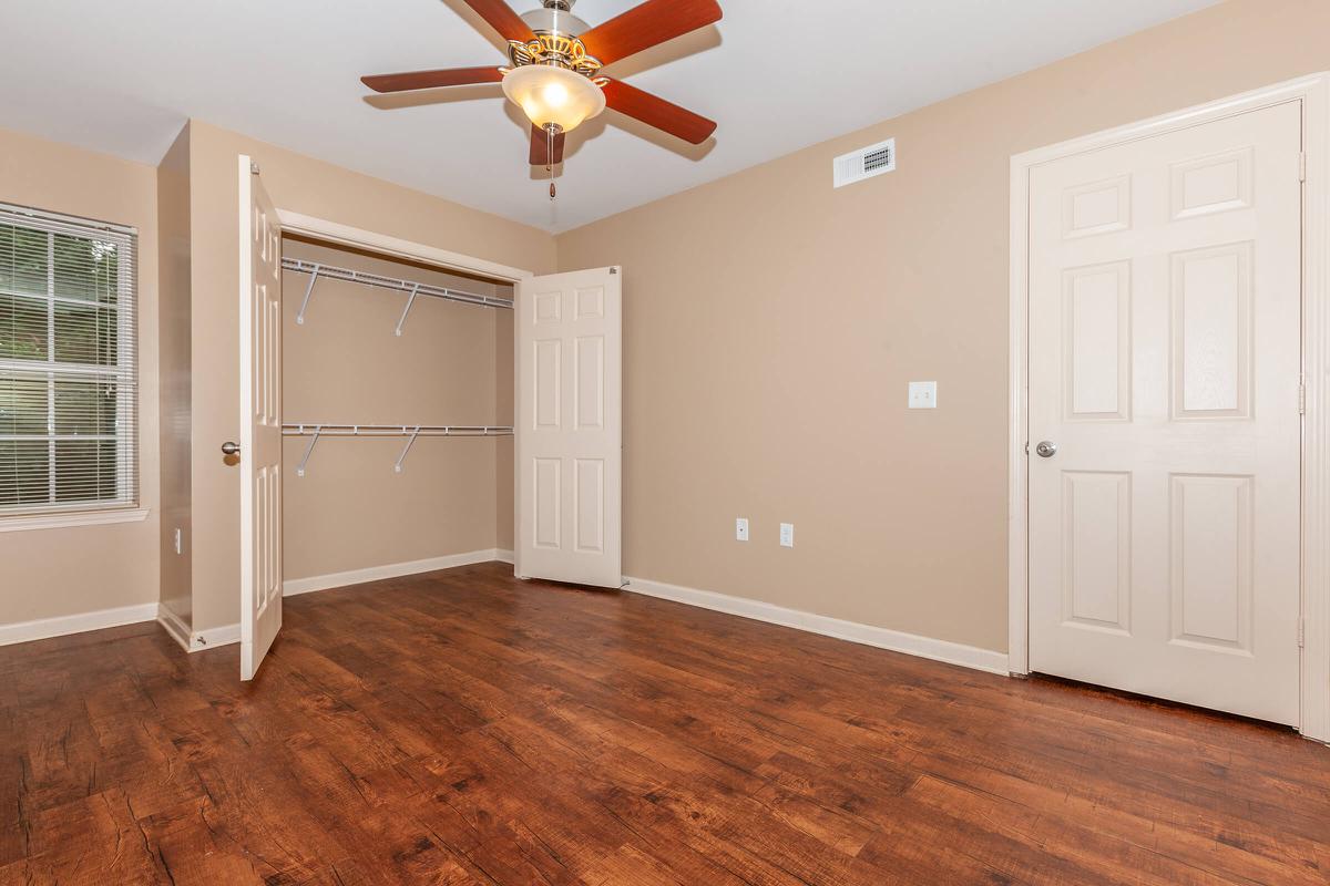 a large empty room with a wood floor