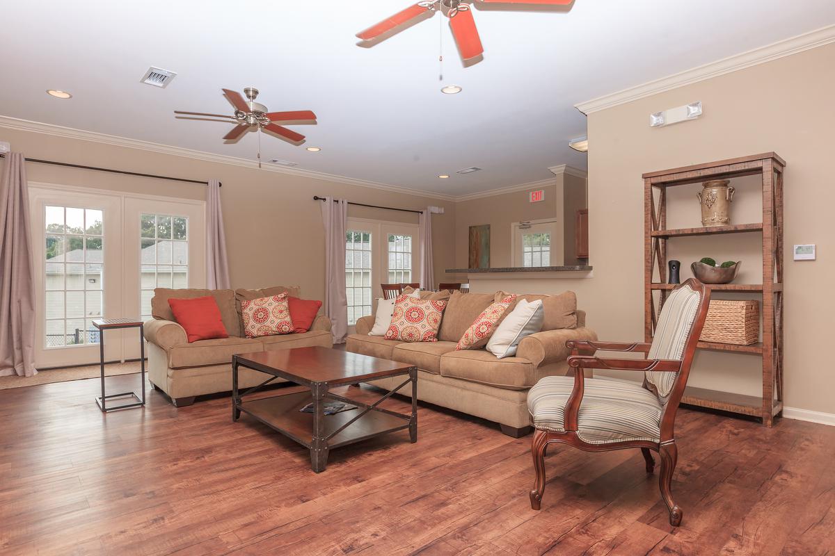 a living room filled with furniture and a fireplace