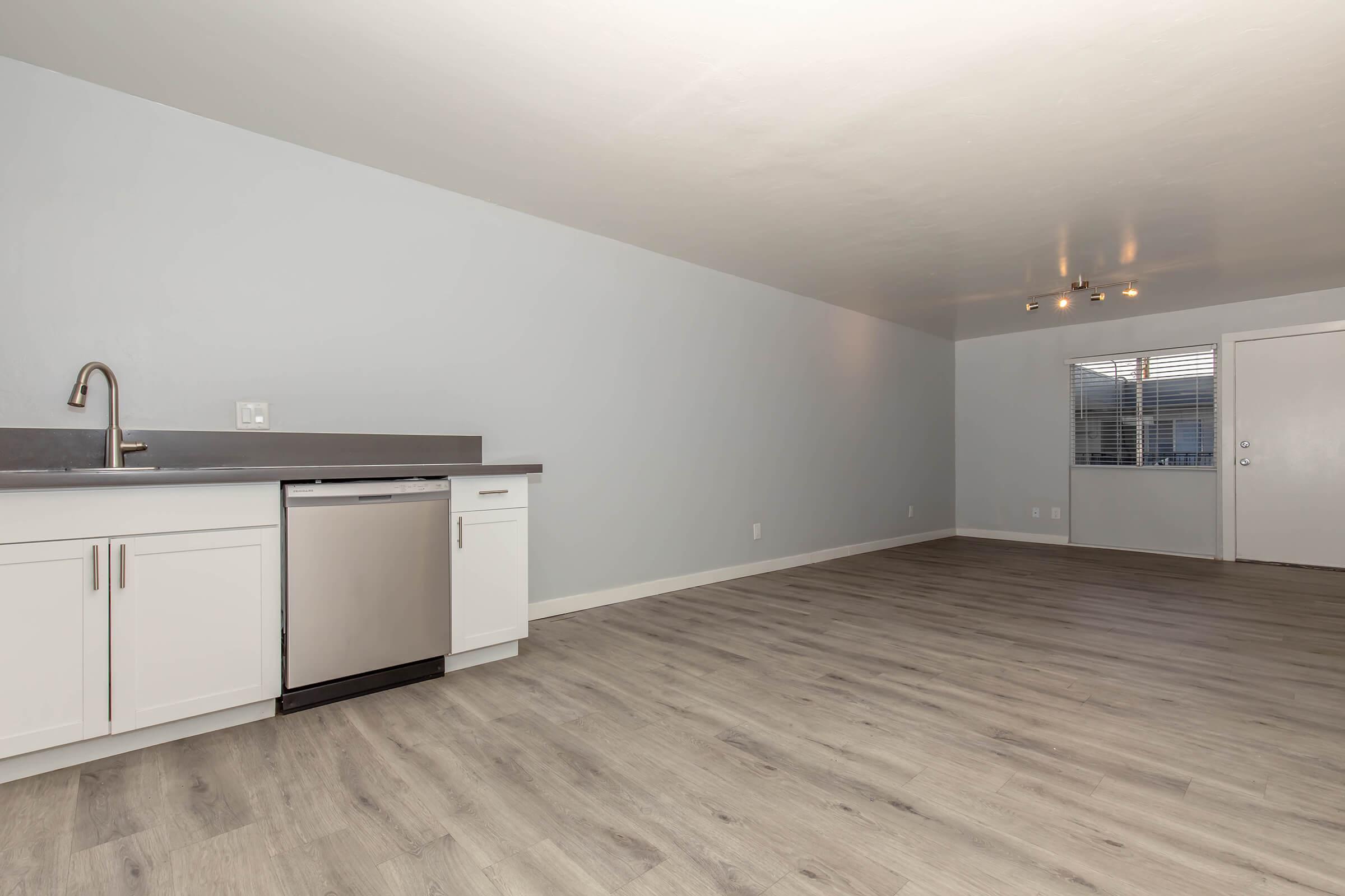 a kitchen with a wooden floor