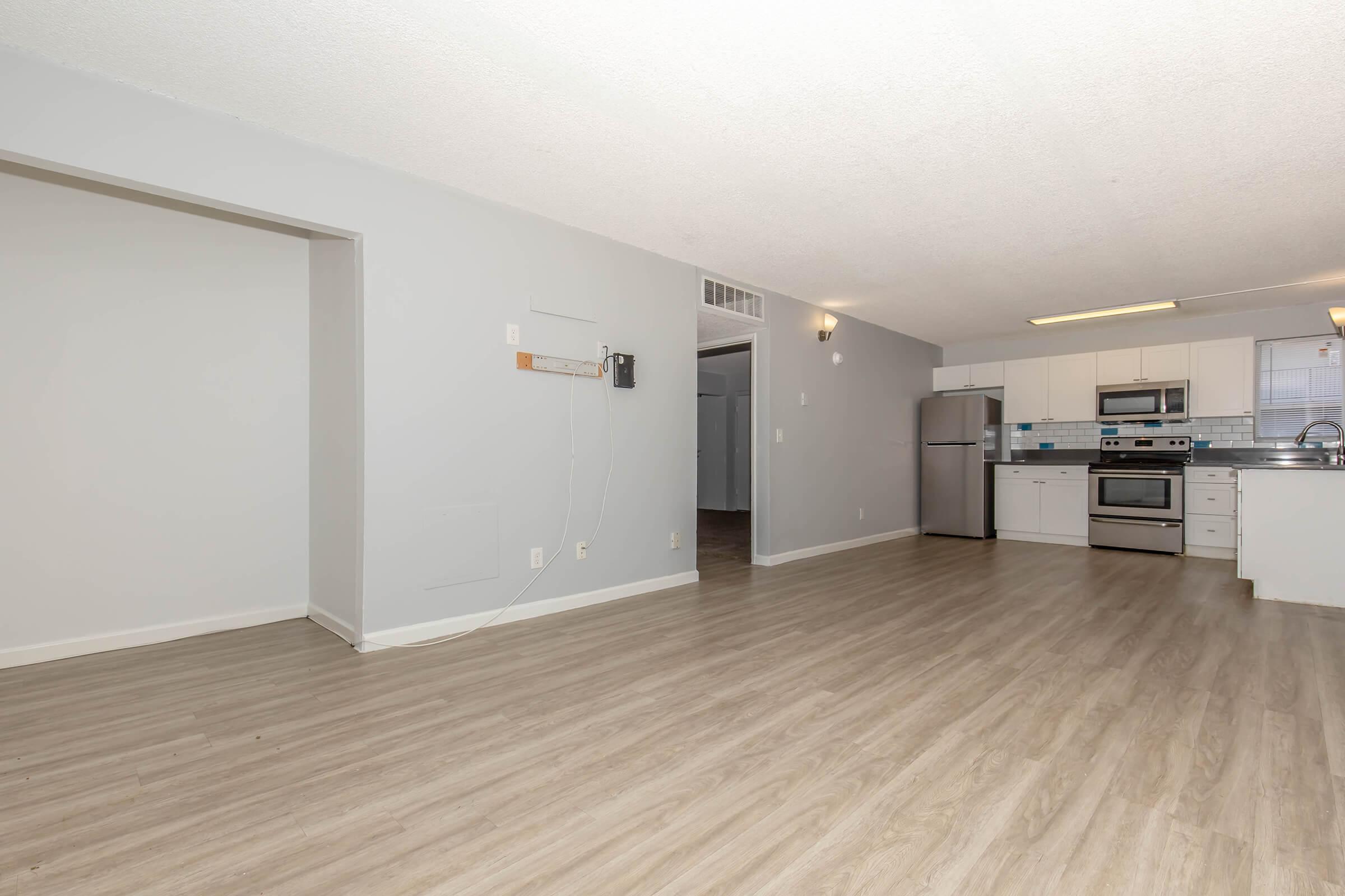 a kitchen with a wood floor