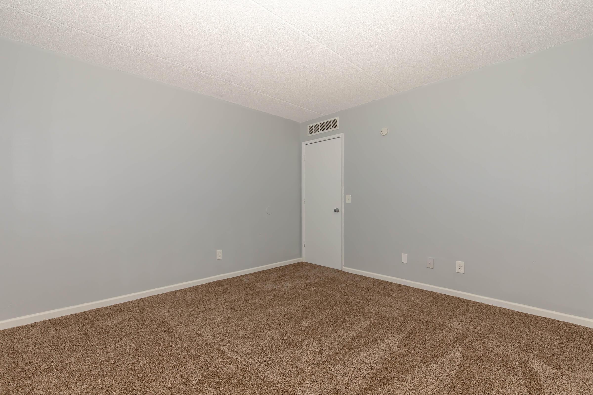 a bedroom with a large mirror