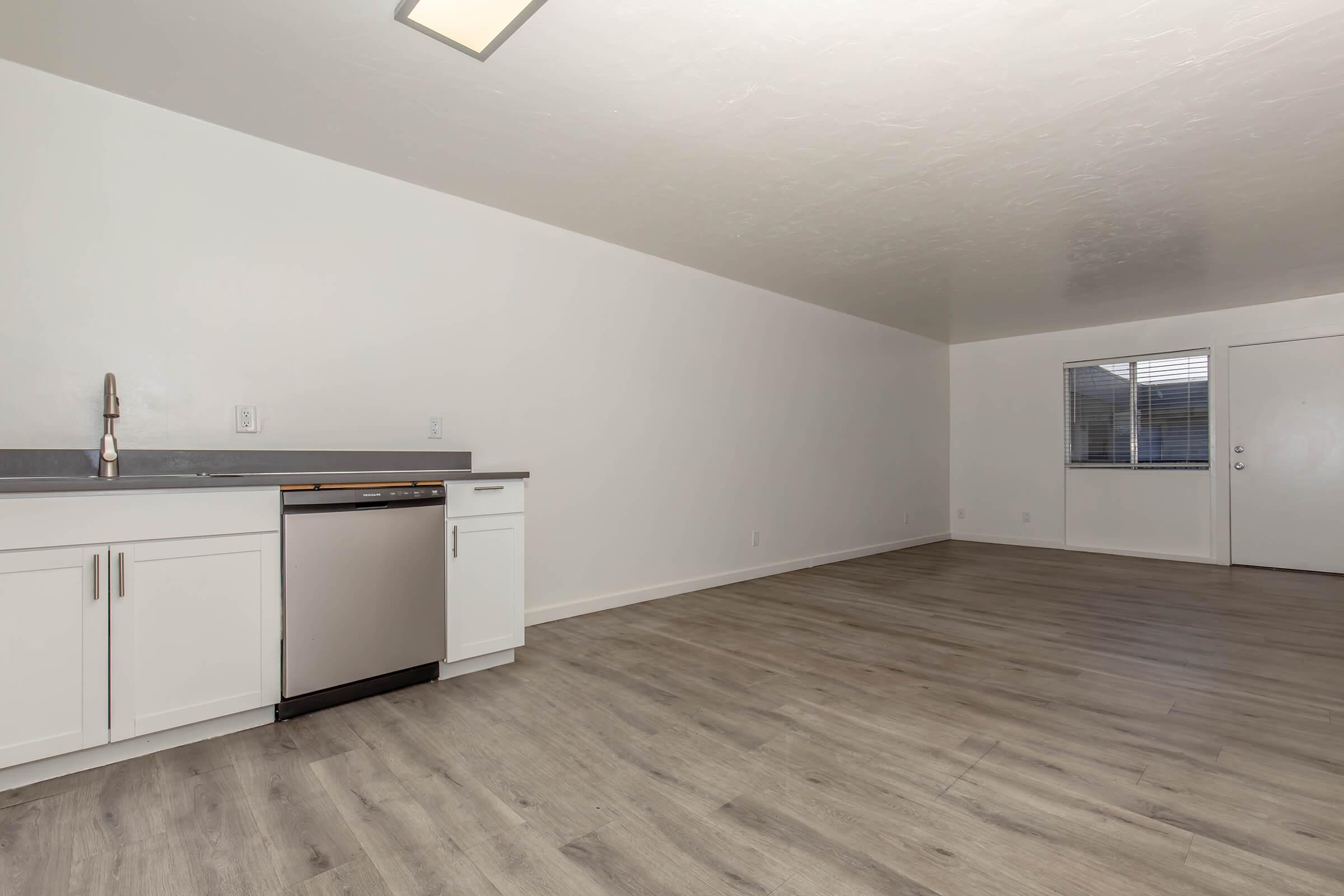 a kitchen with a wooden floor