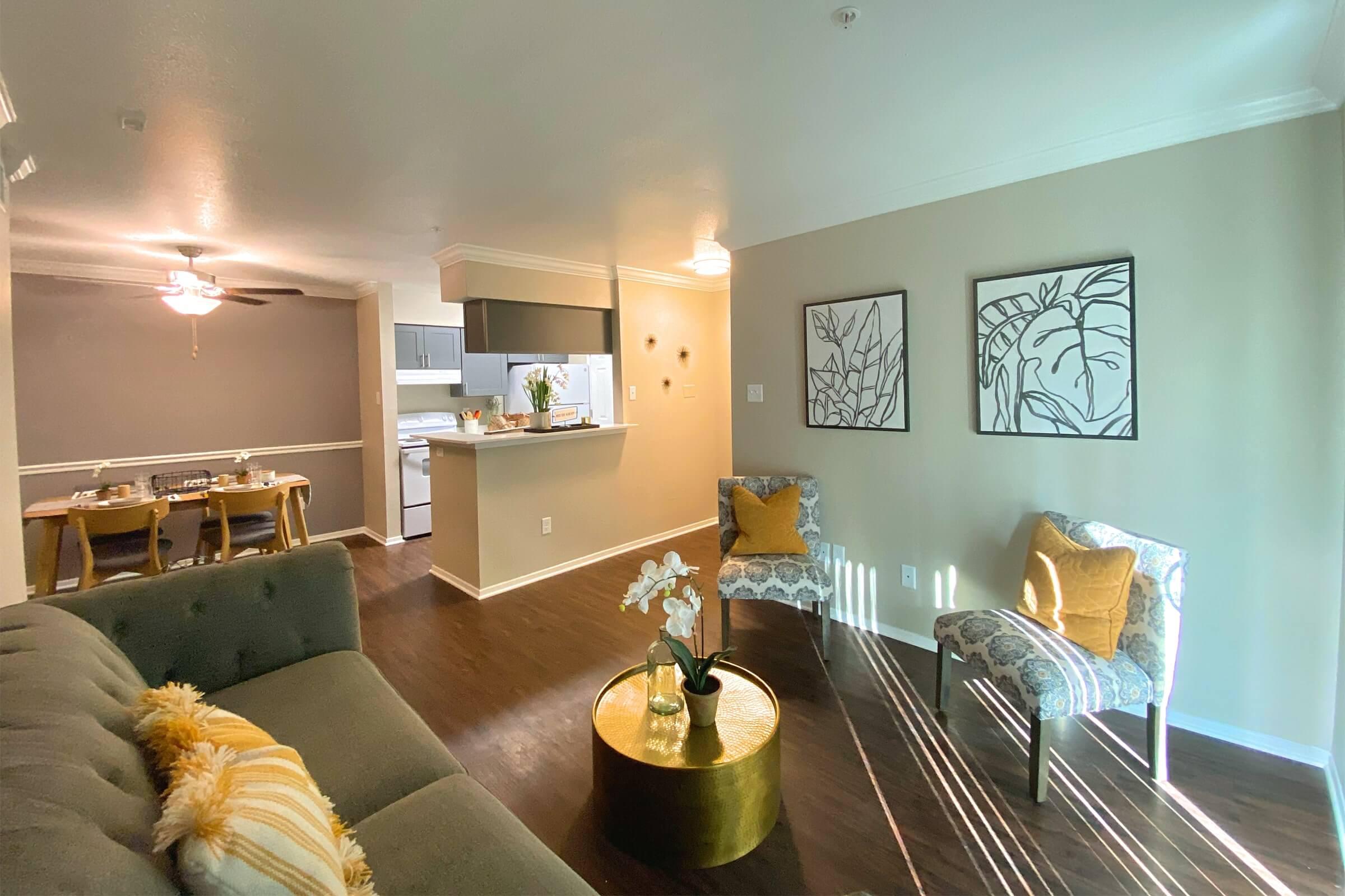 a living room filled with furniture and a fireplace