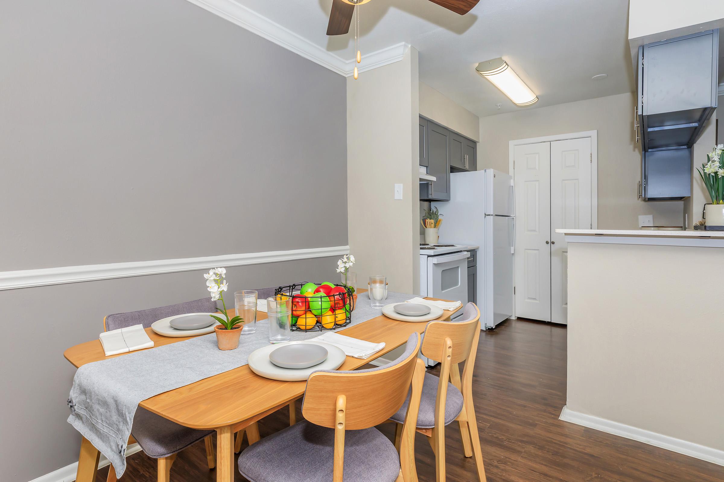 a kitchen with a table in a room