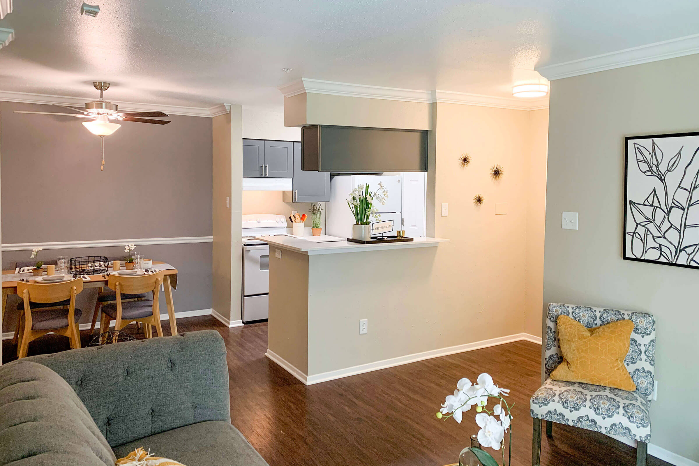 a living room filled with furniture and a tv