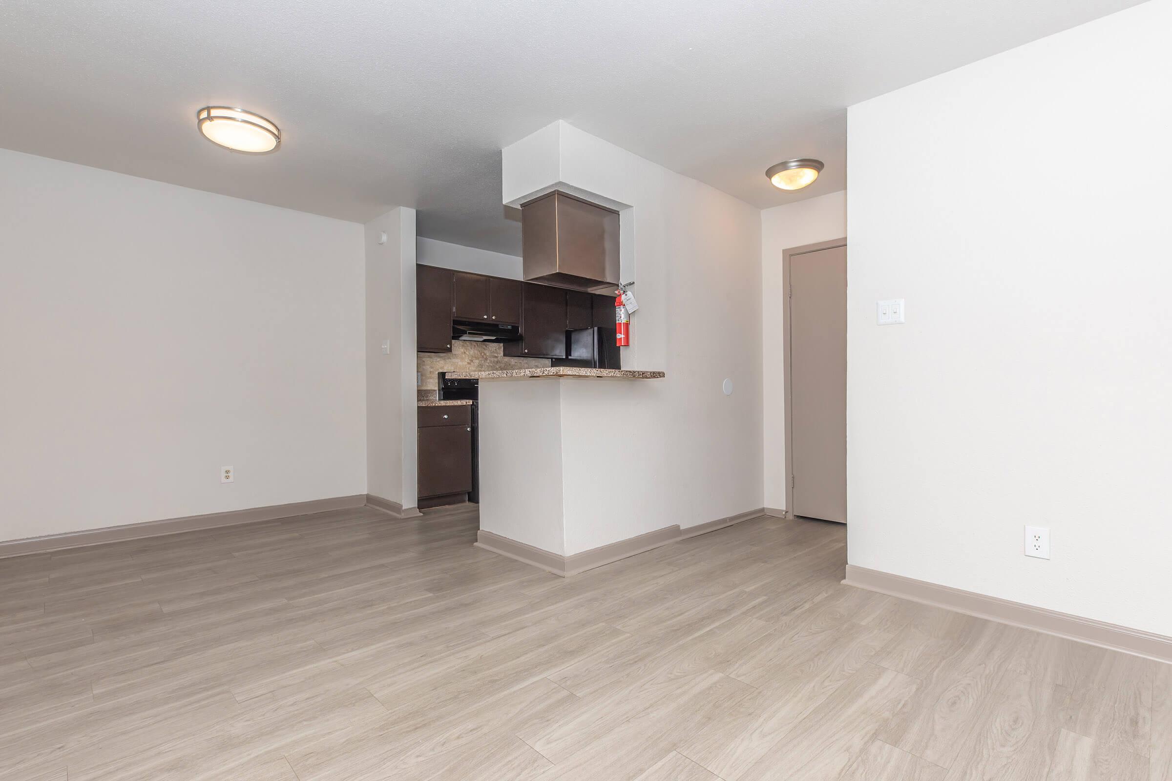 a kitchen with a wooden floor