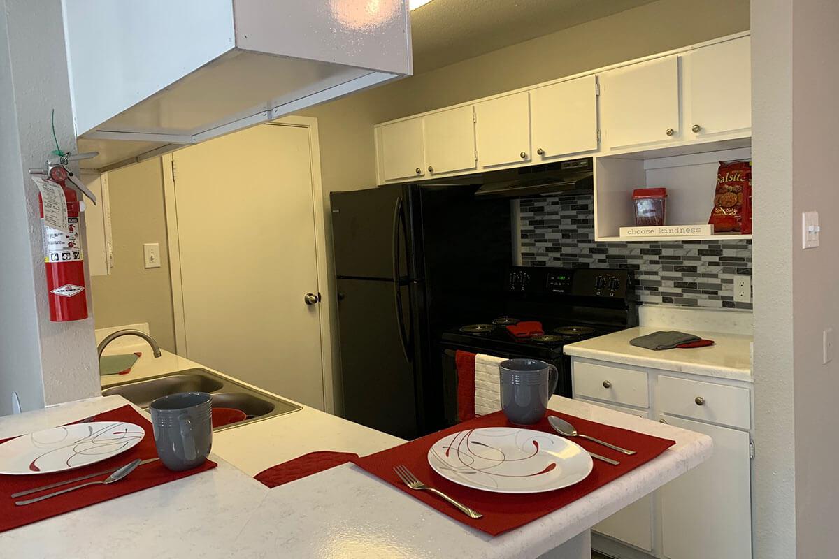 a kitchen with a stove top oven sitting inside of a refrigerator