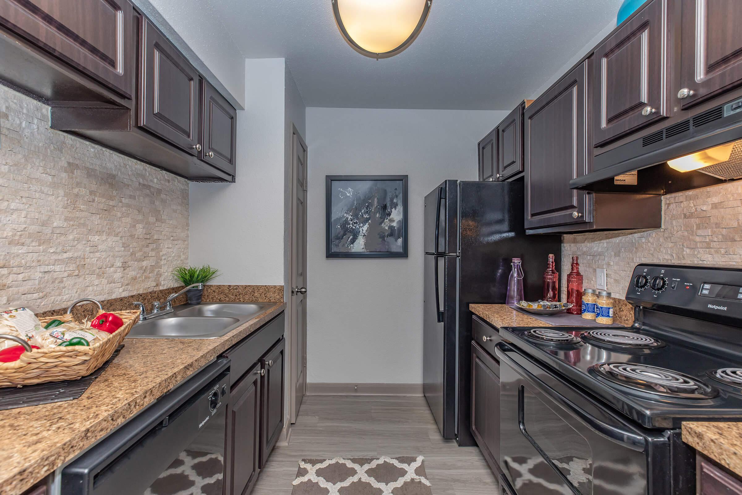 a large kitchen with stainless steel appliances