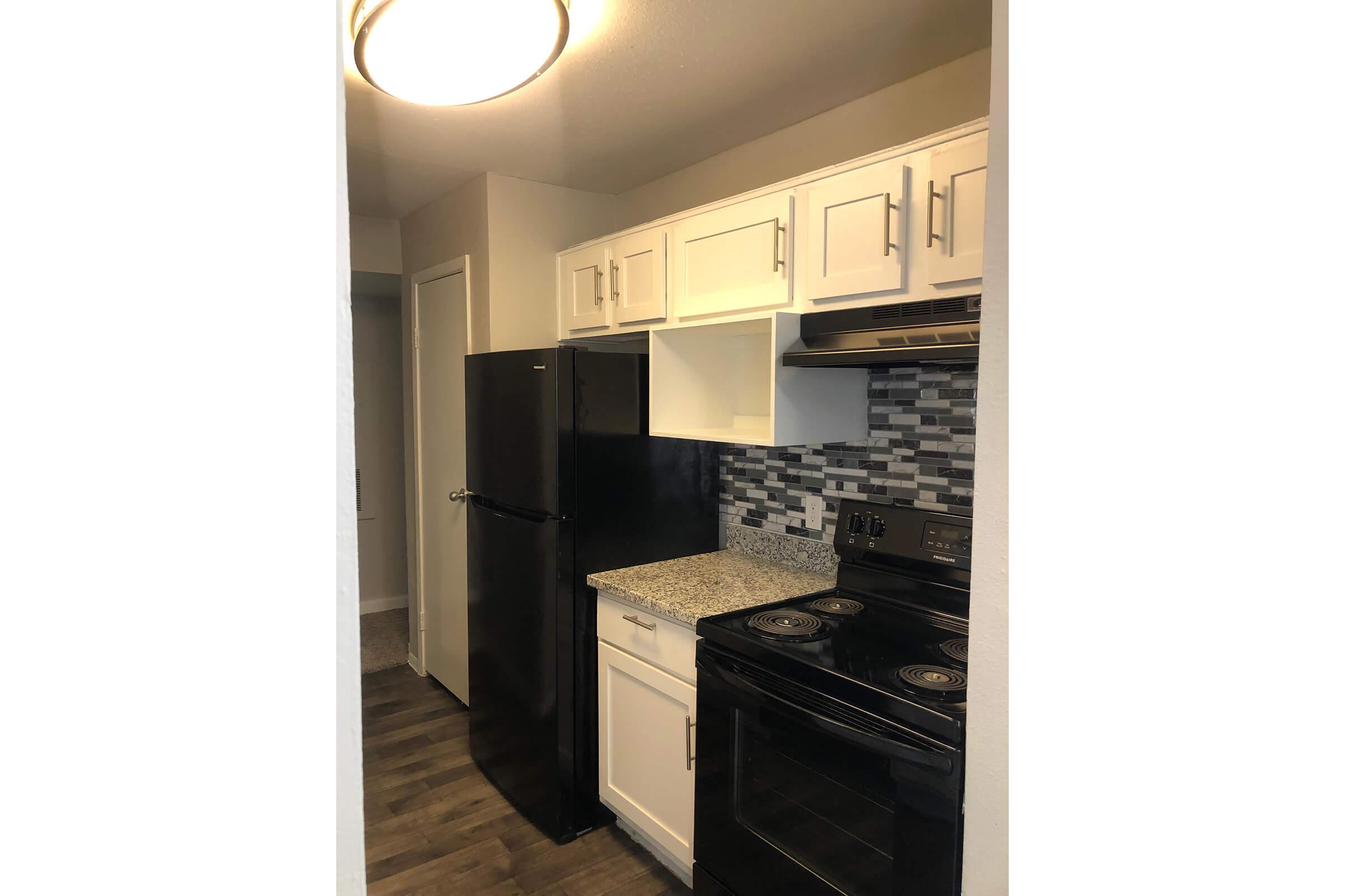 a stainless steel refrigerator in a kitchen