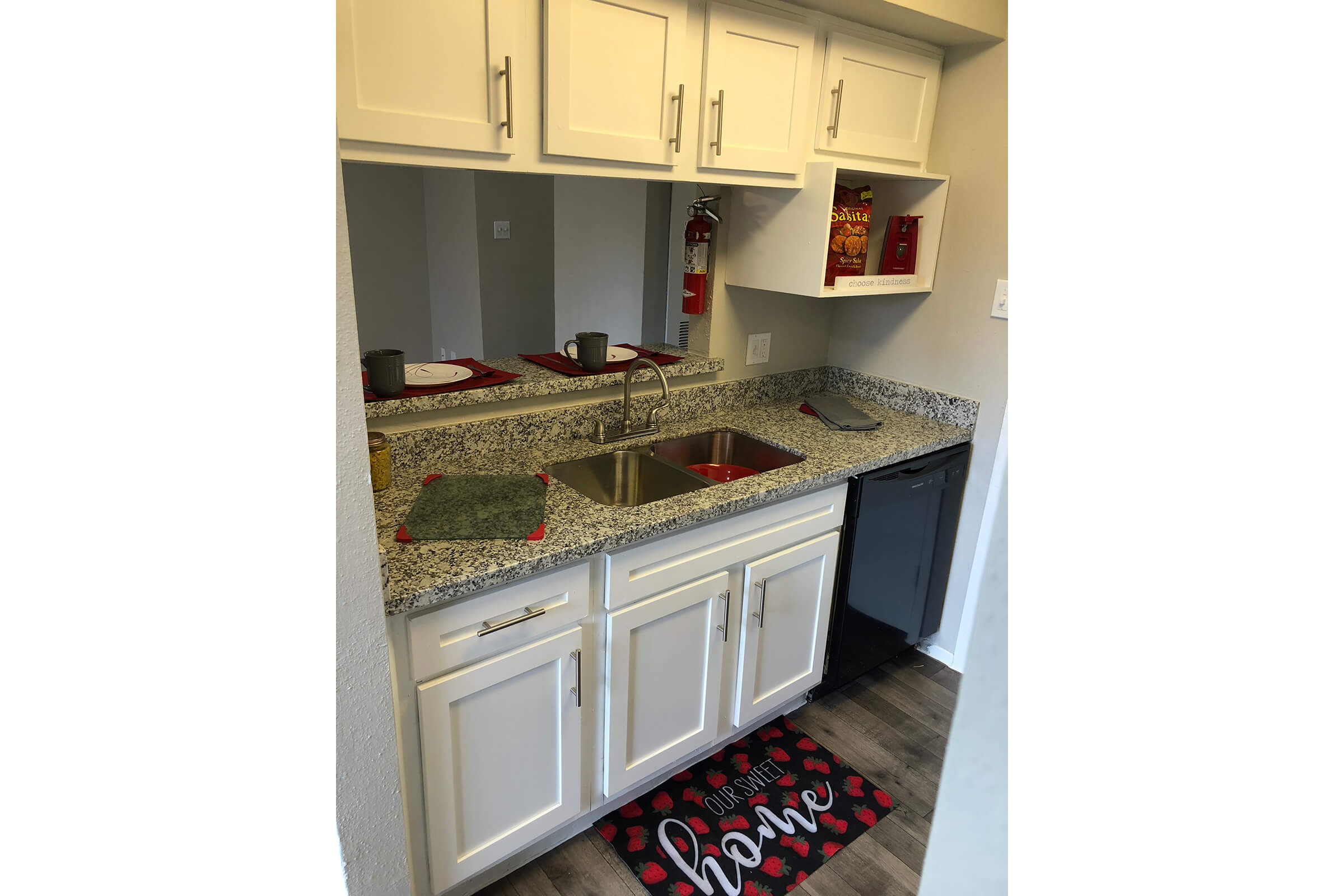 a kitchen with a stove and a refrigerator