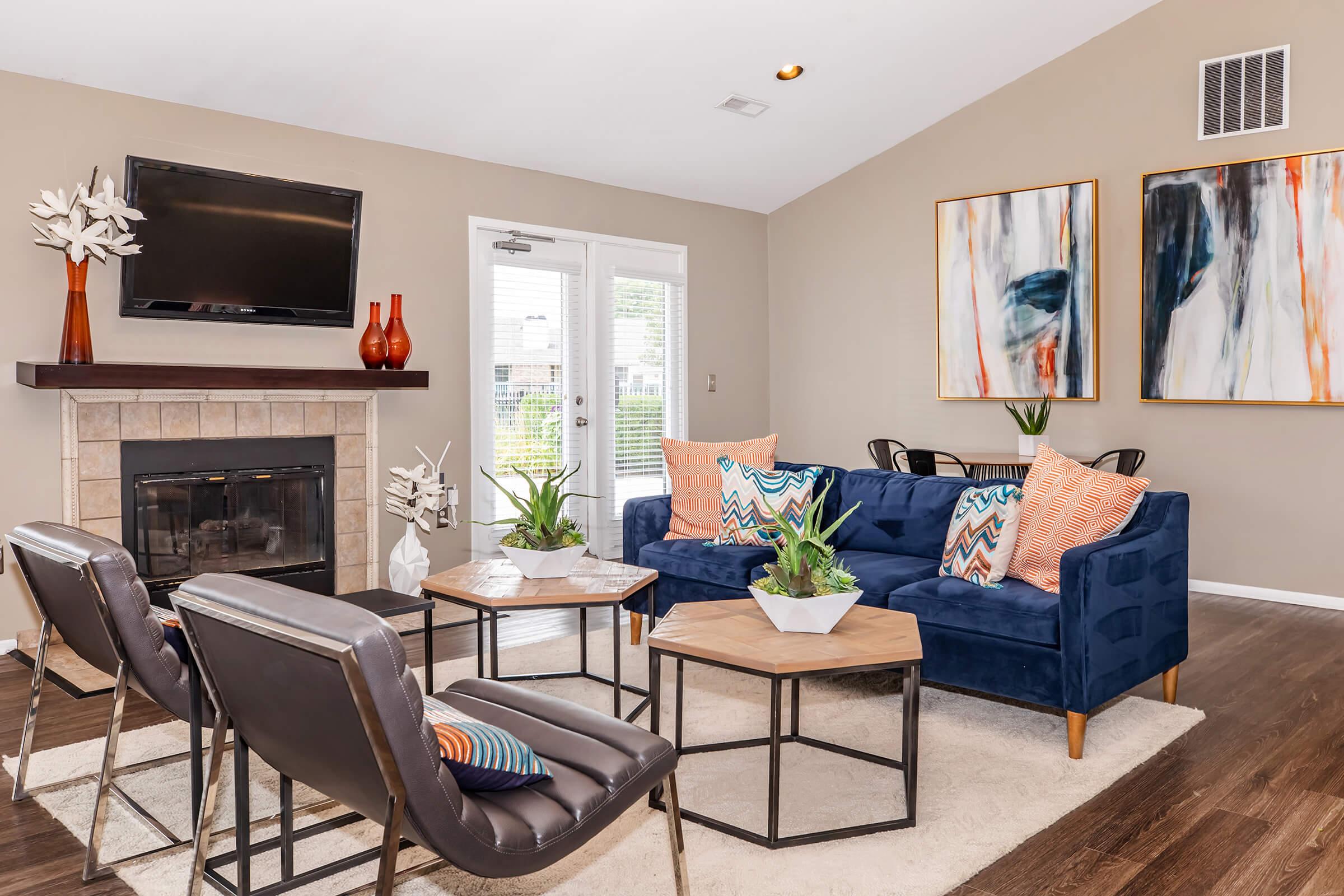 a living room filled with furniture and a fire place