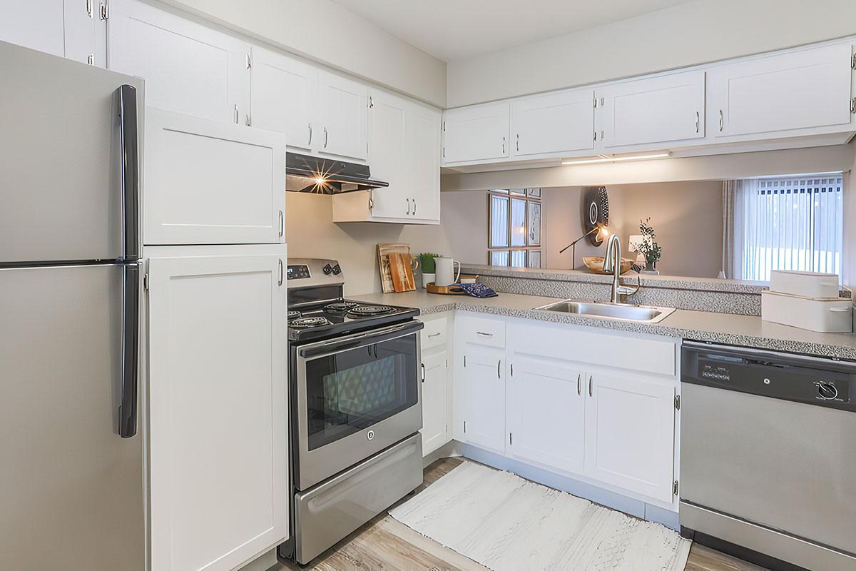 a kitchen with a stove top oven sitting inside of a refrigerator