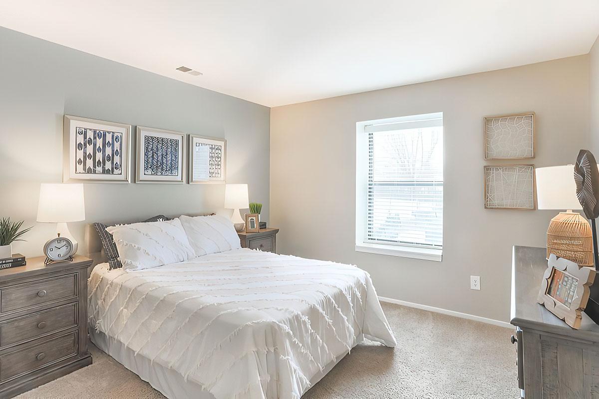 a bedroom with a large bed in a room