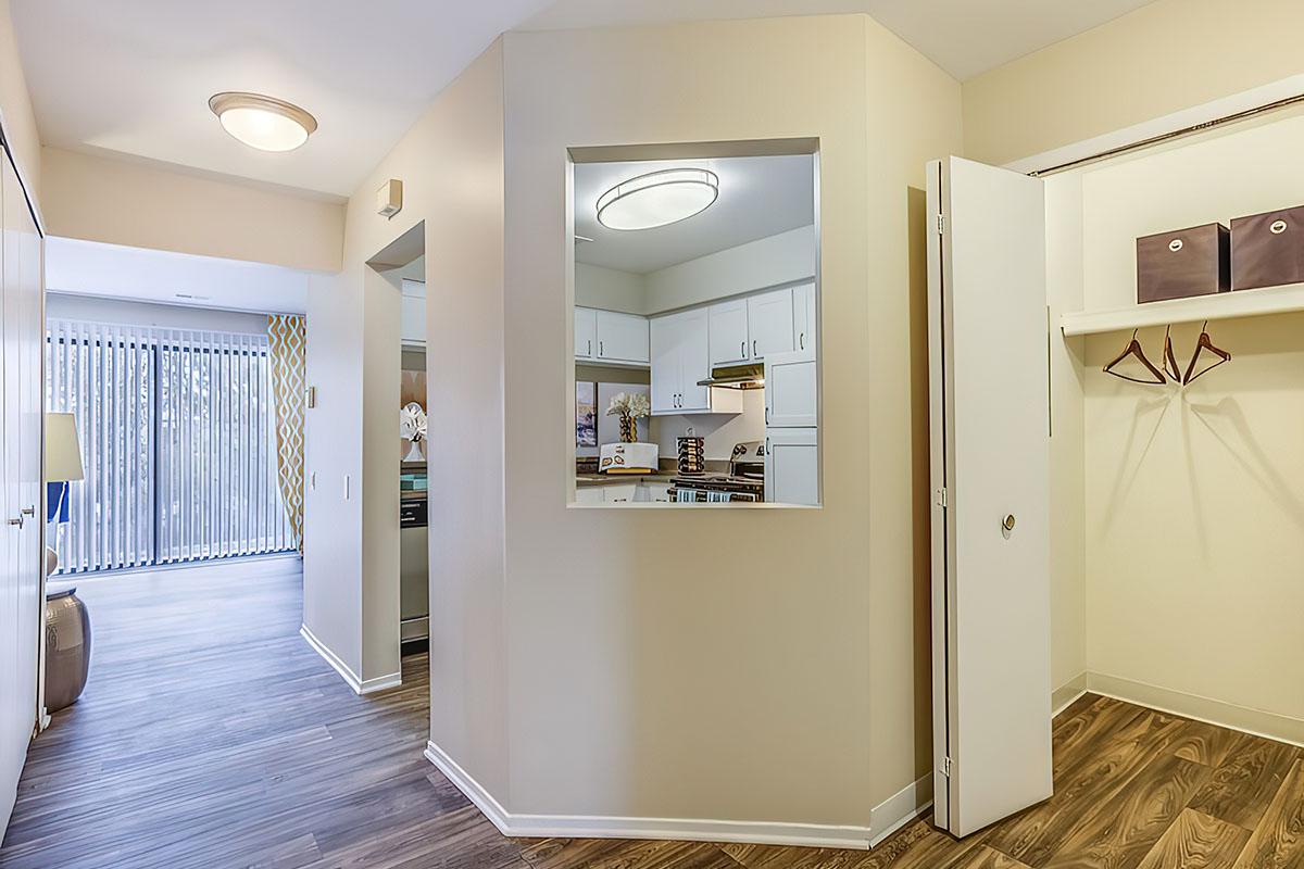 a large empty room with a sink and a mirror