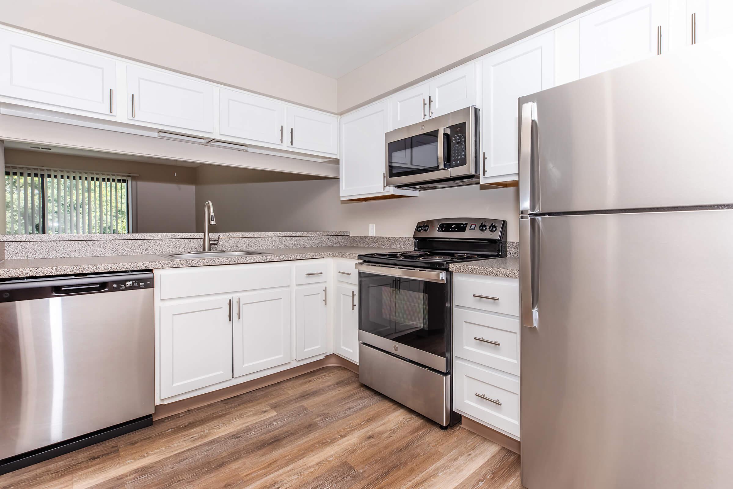 a stainless steel refrigerator in a kitchen