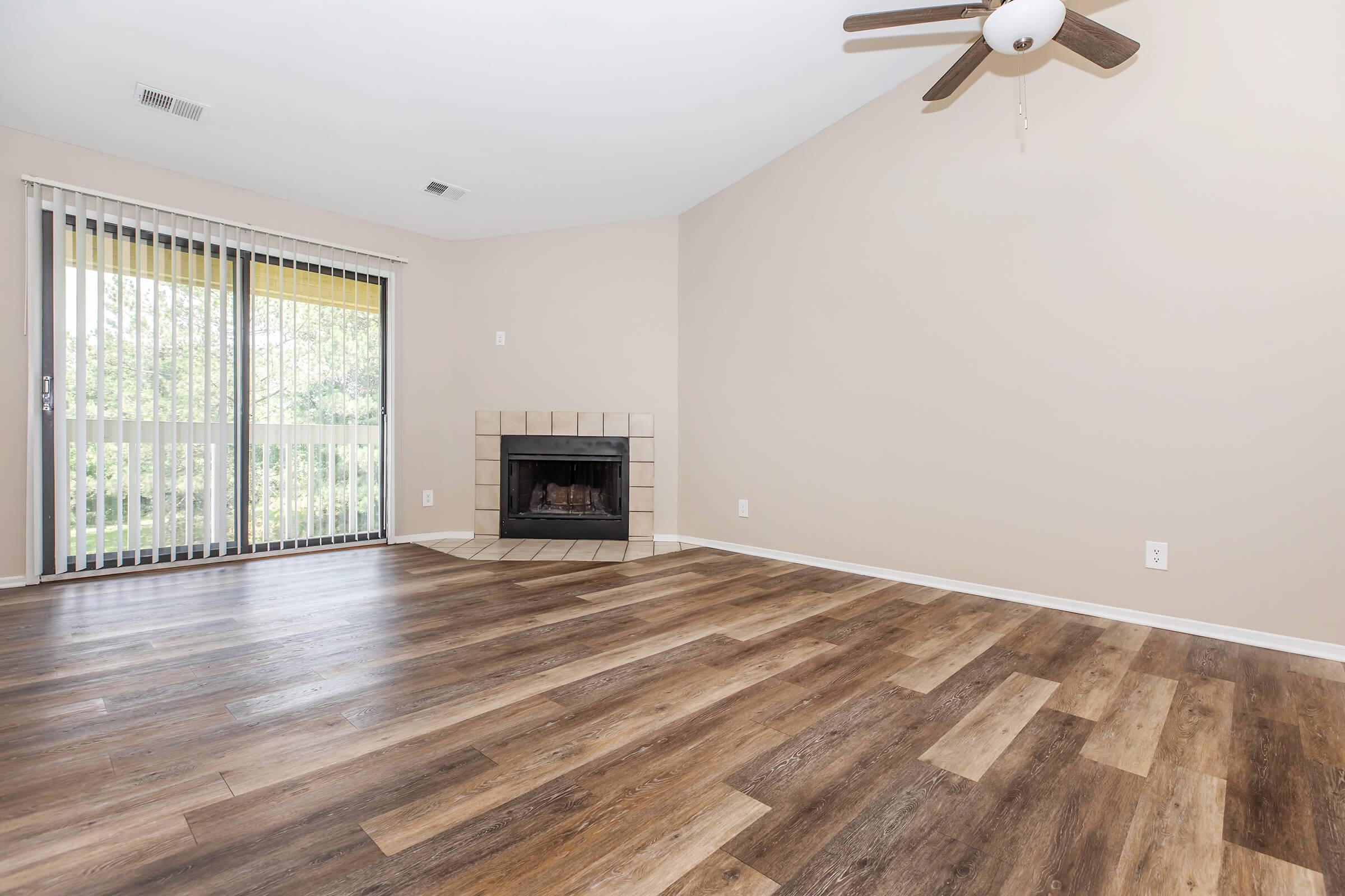 a view of a living room with a wooden floor