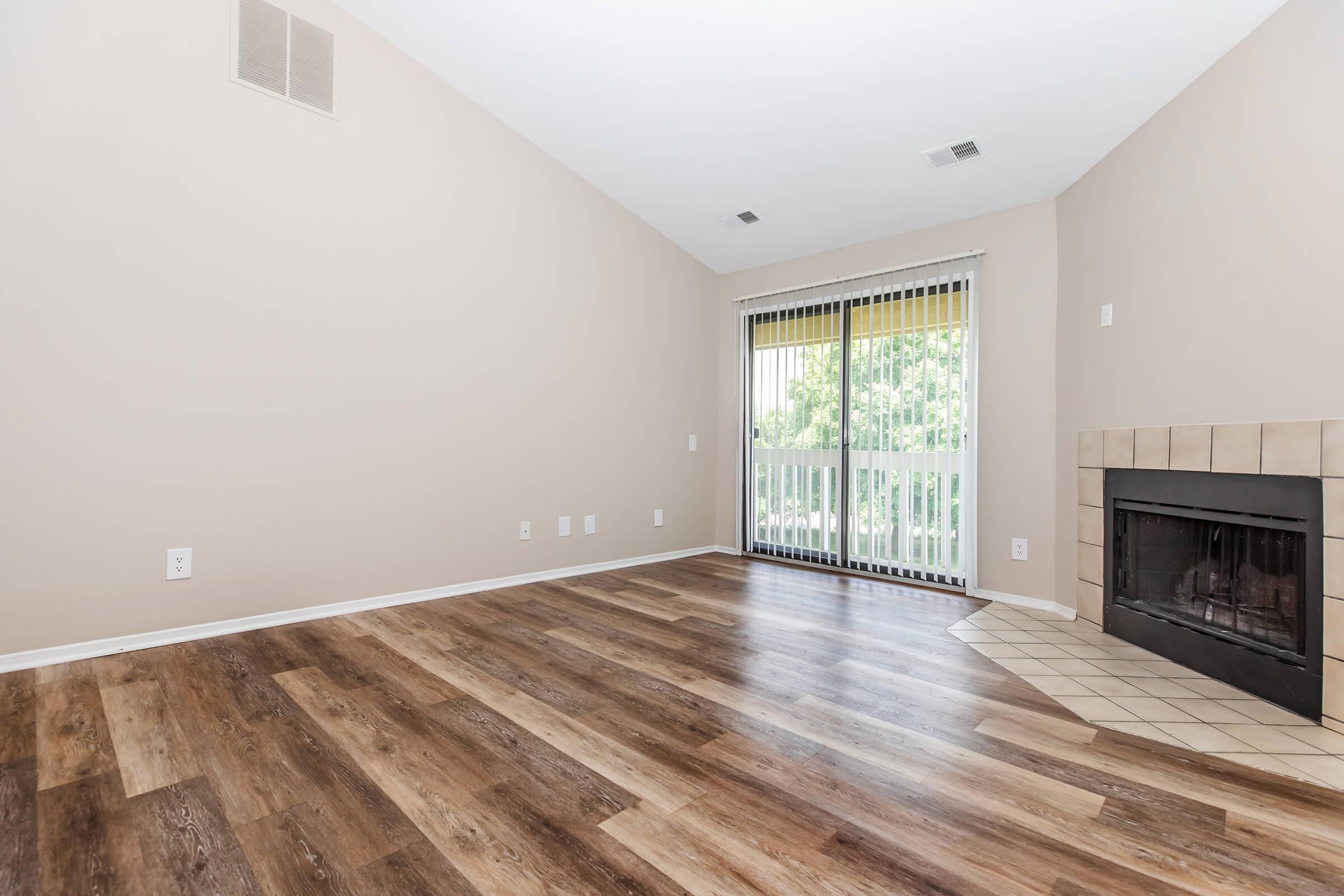 a living room filled with furniture and a flat screen tv