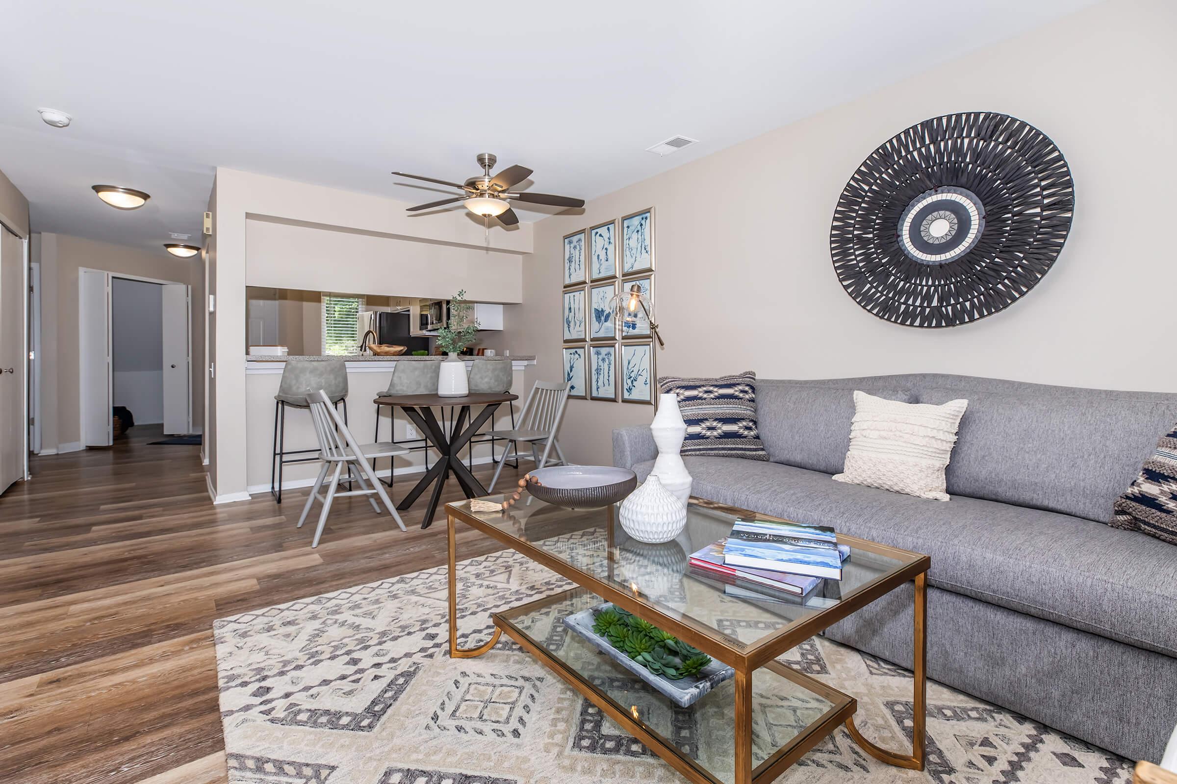 a living room filled with furniture and a fireplace