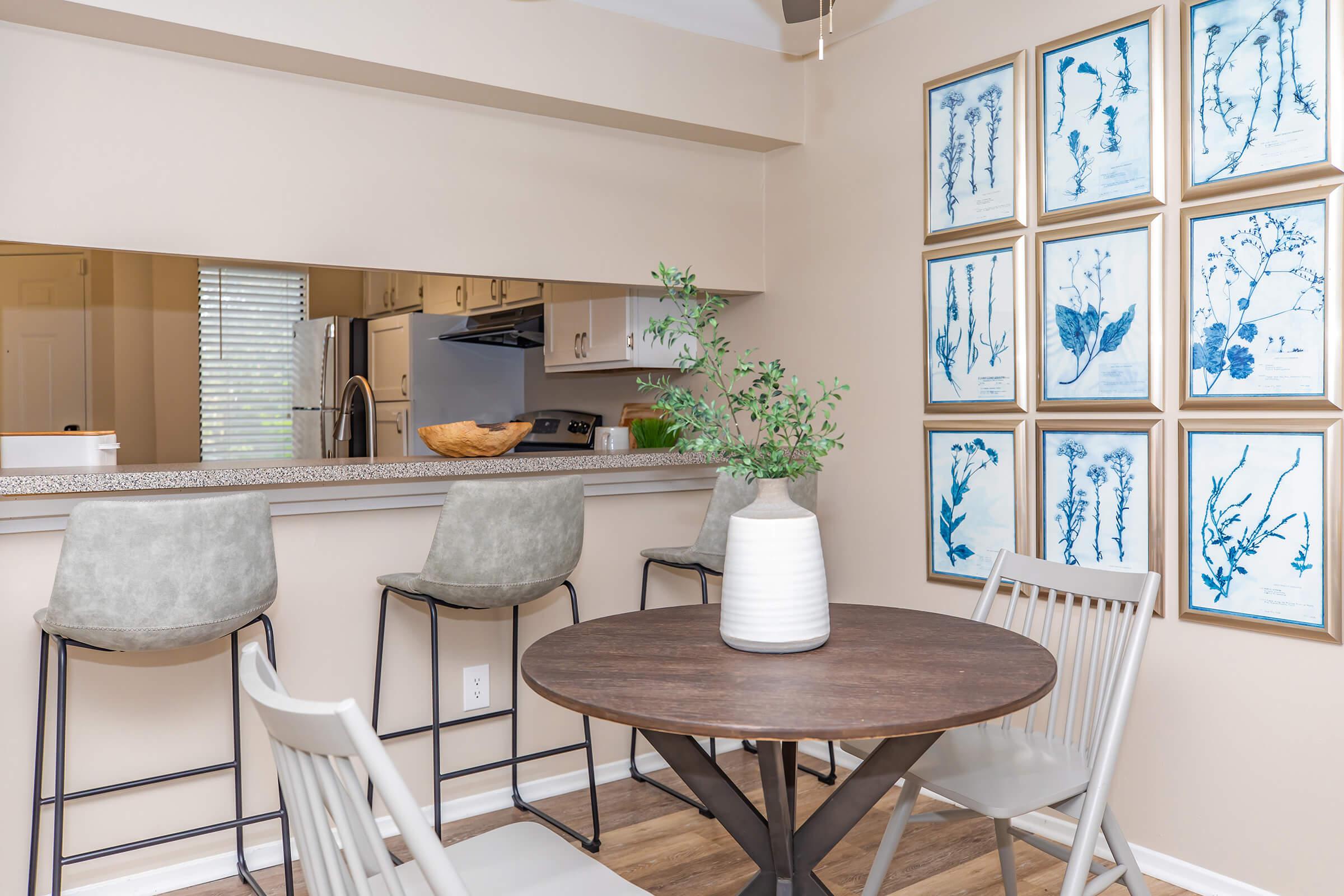 a living area with a desk and chair in a room