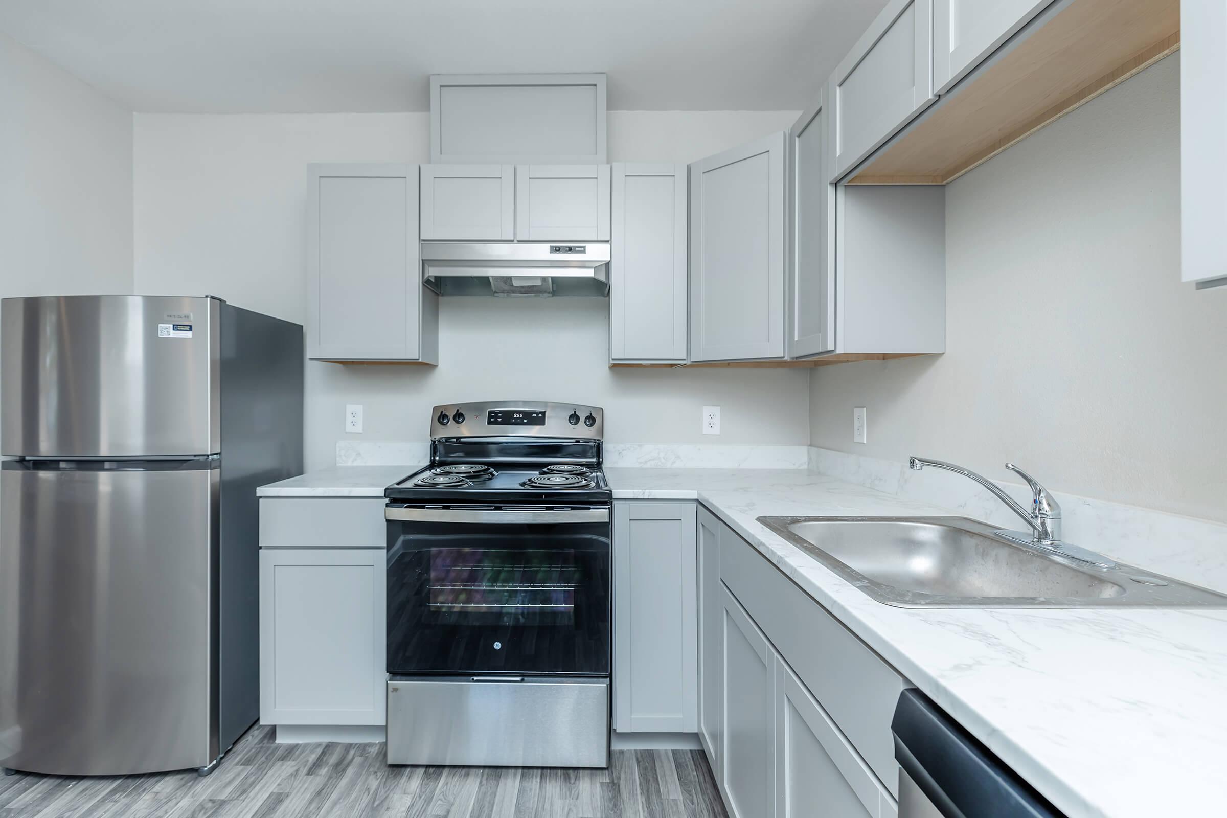 a kitchen with a stove top oven sitting inside of a refrigerator