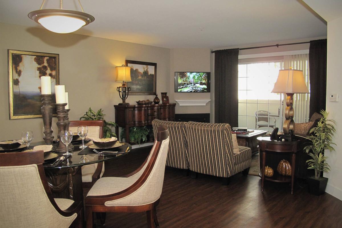 a living room filled with furniture and a large window